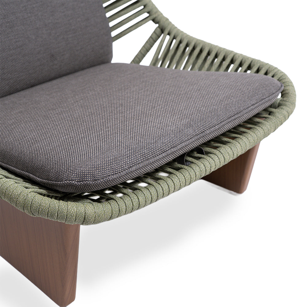 Beacon Clogs lounge armchair with seat and back cushions, featuring a sleek modern design and comfortable upholstered seating.