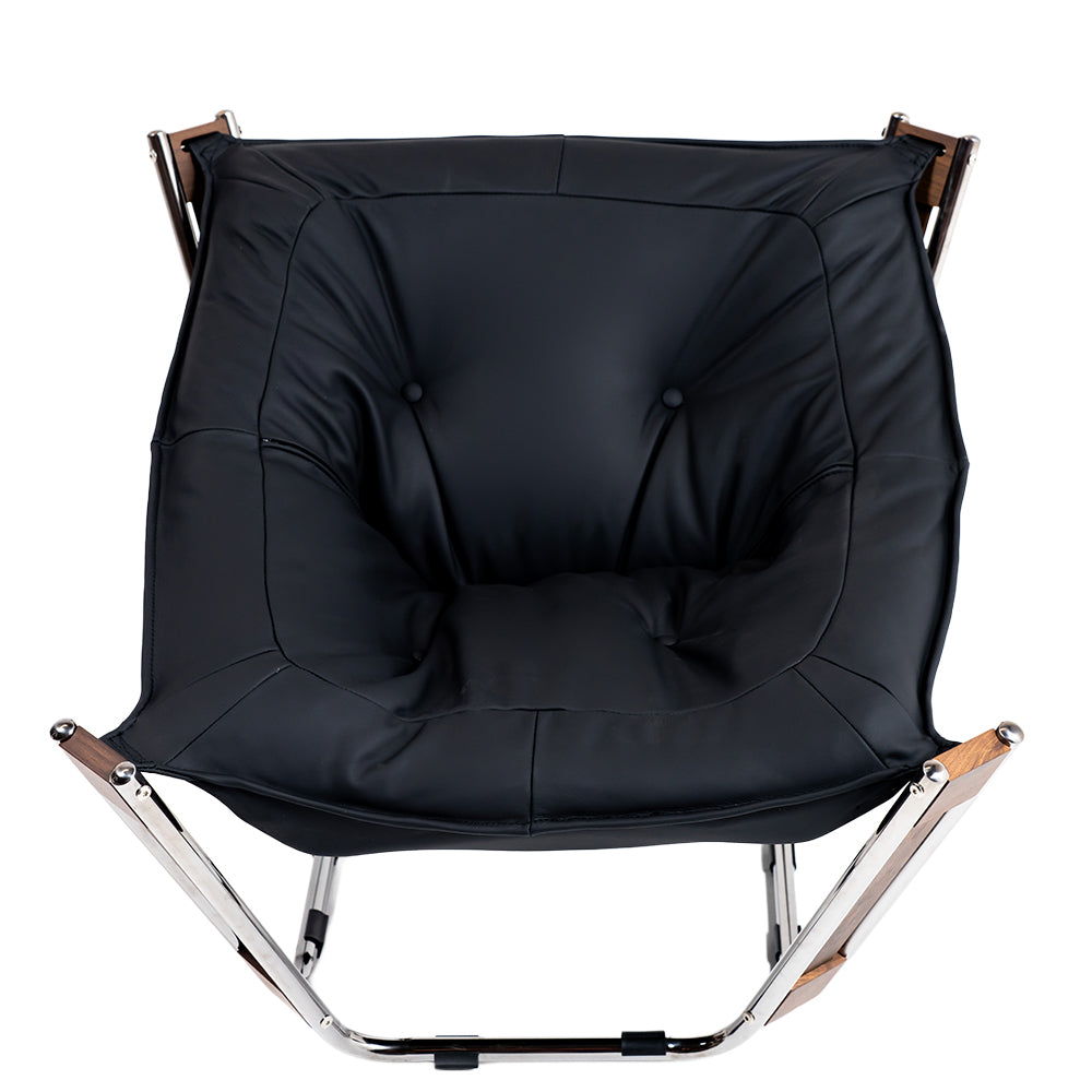 Black Cocoon Lounge Chair by BEACON, modern ergonomic lounge chair with a cozy, rounded design for relaxing comfort.