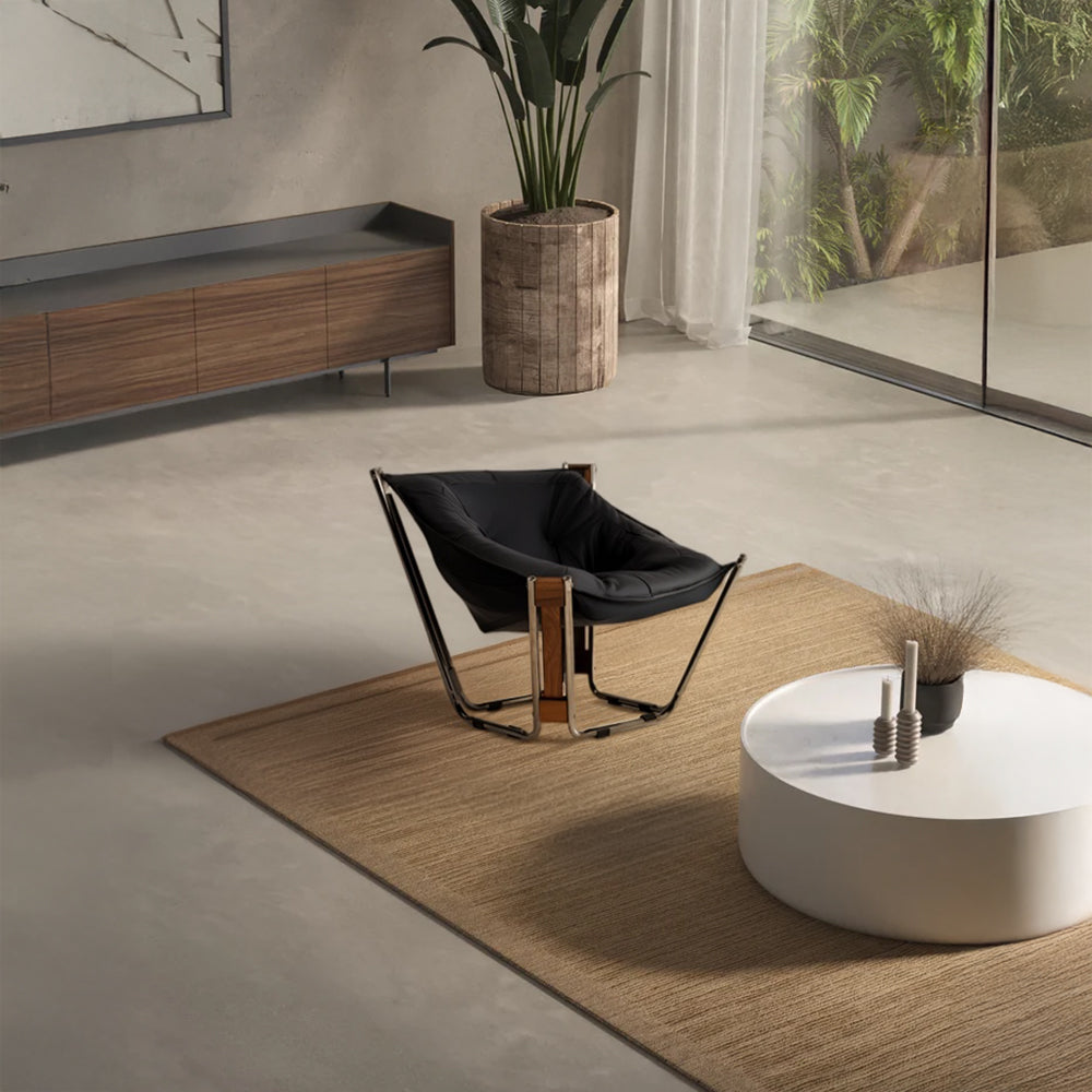 Black Cocoon Lounge Chair by BEACON, modern round design with plush cushioning and sleek black upholstery.