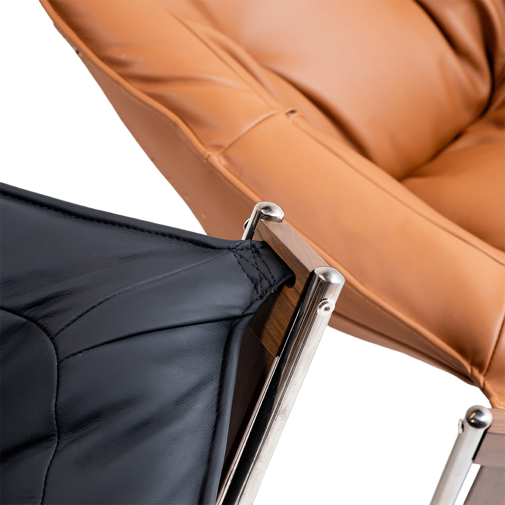 Black Cocoon Lounge Chair by BEACON, modern ergonomic lounge chair with a cozy, rounded design for relaxation.