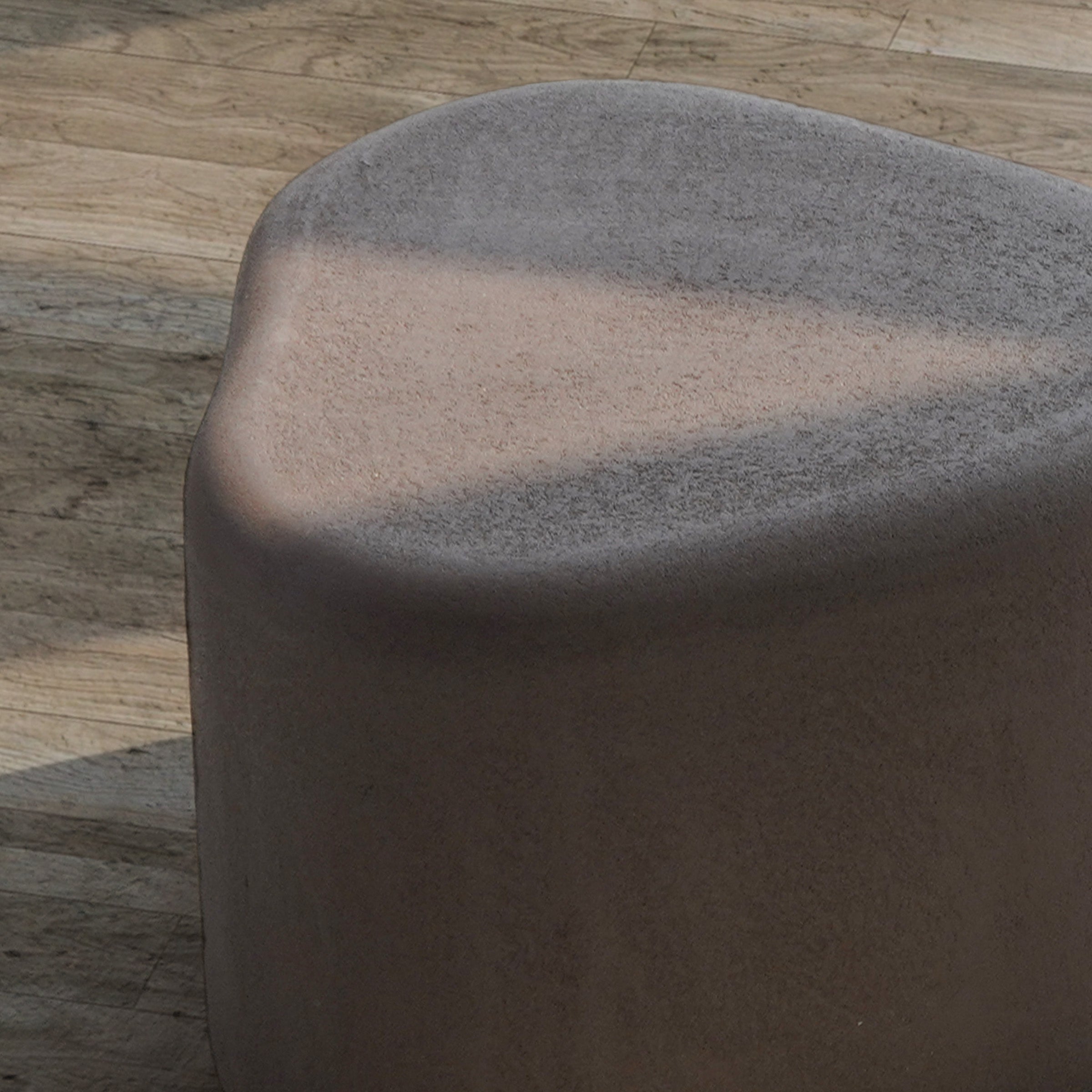 Coffee brown BEACON planter box and seating bench made of durable material, featuring a stylish outdoor garden design.