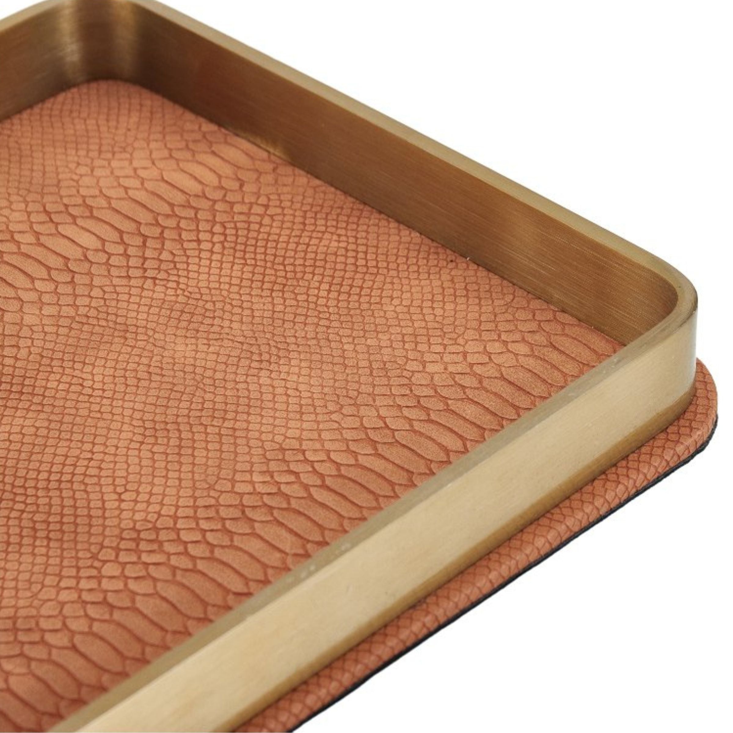 Brushed gold leather decorative tray by Beacon featuring a sleek rectangular design with raised edges.