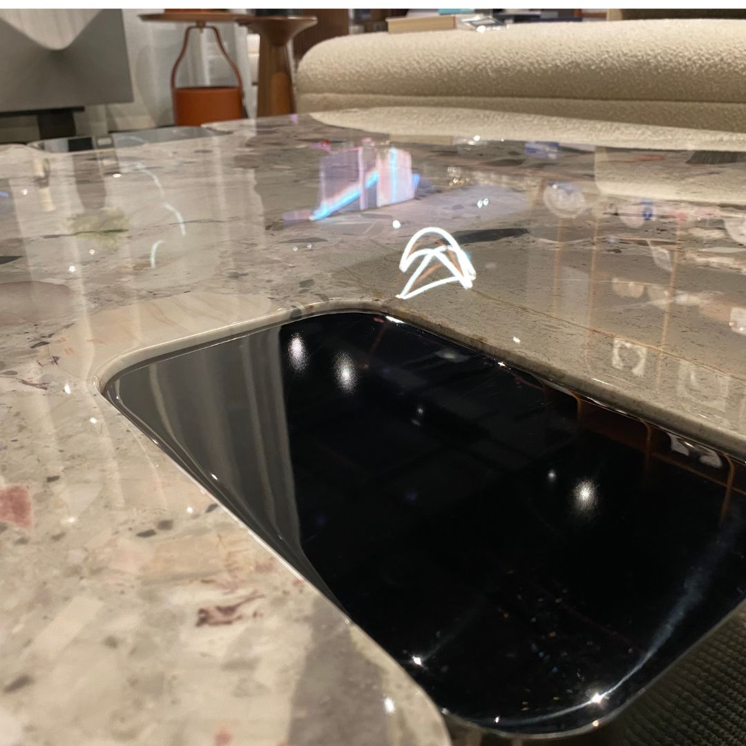 Modern coffee table with natural stone top and stainless steel legs, designed by BEACON, model LT053H.