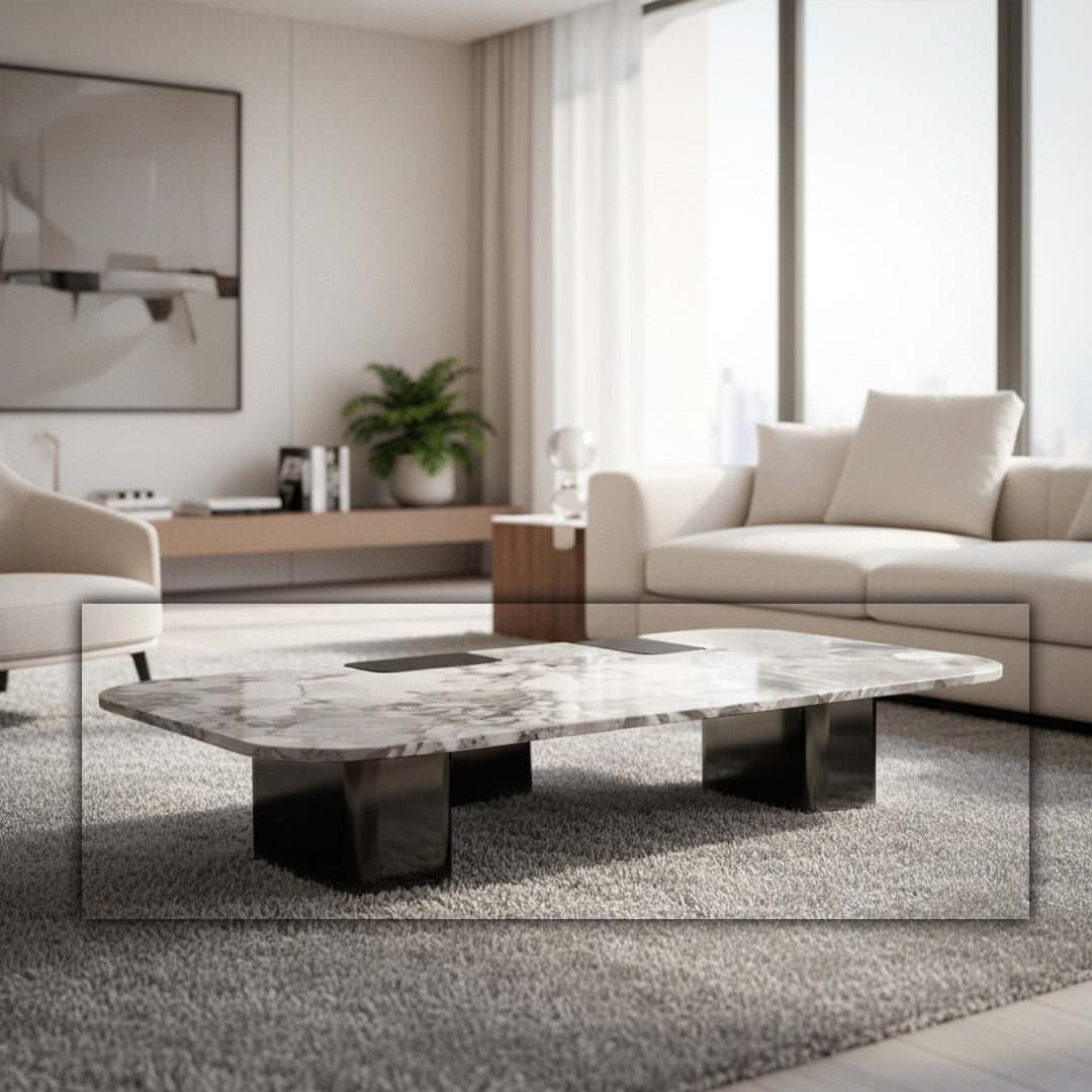 Modern coffee table with a natural stone top and stainless steel legs, featuring sleek, contemporary design.