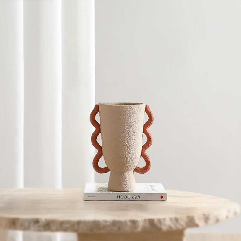 Colorful Ring Vase by BEACON features vibrant, multicolored rings on a sleek ceramic vase, ideal for decorative floral arrangements.