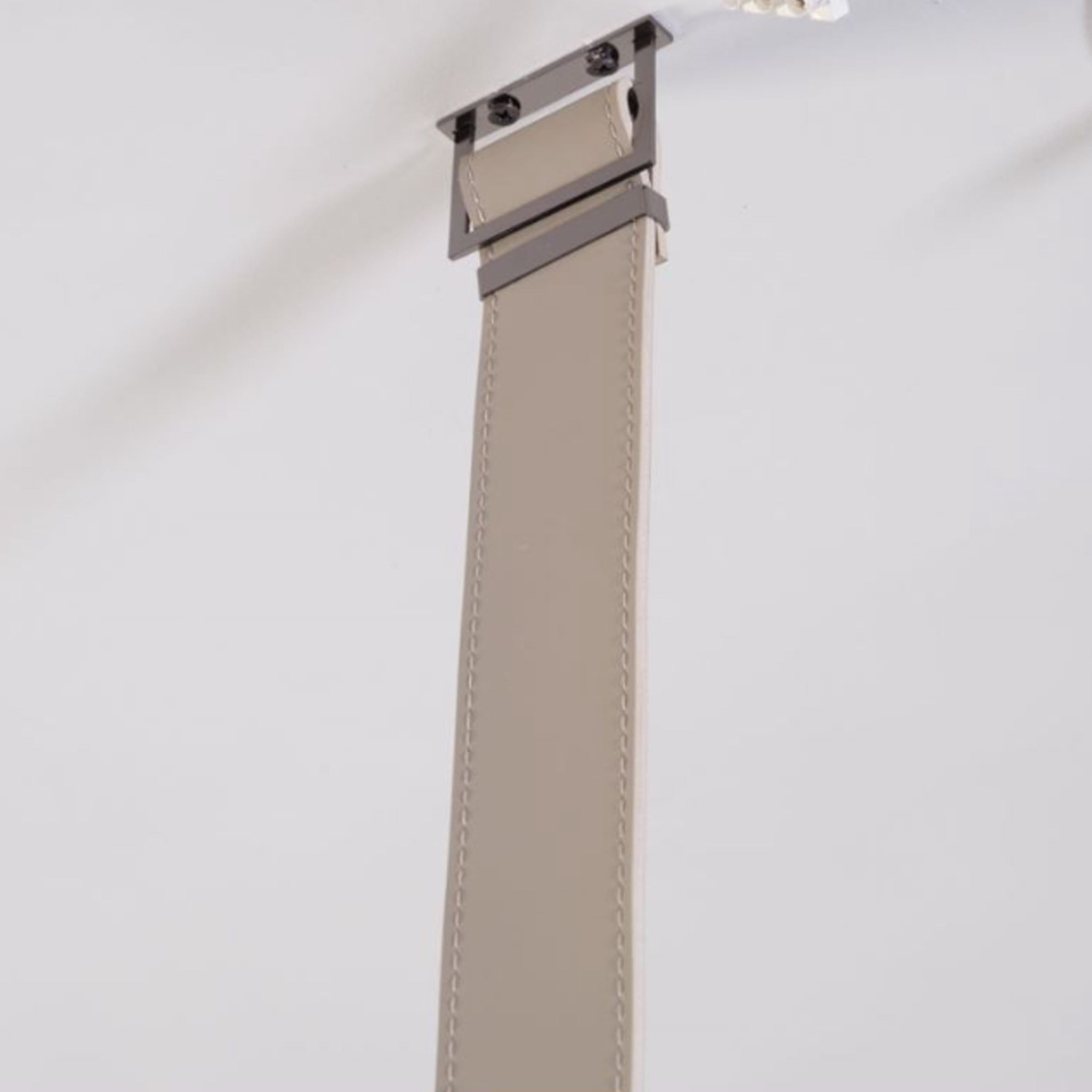 Black leather pendant lamp with comet tail design hanging from a ceiling, 1.5 meters long, by BEACON.