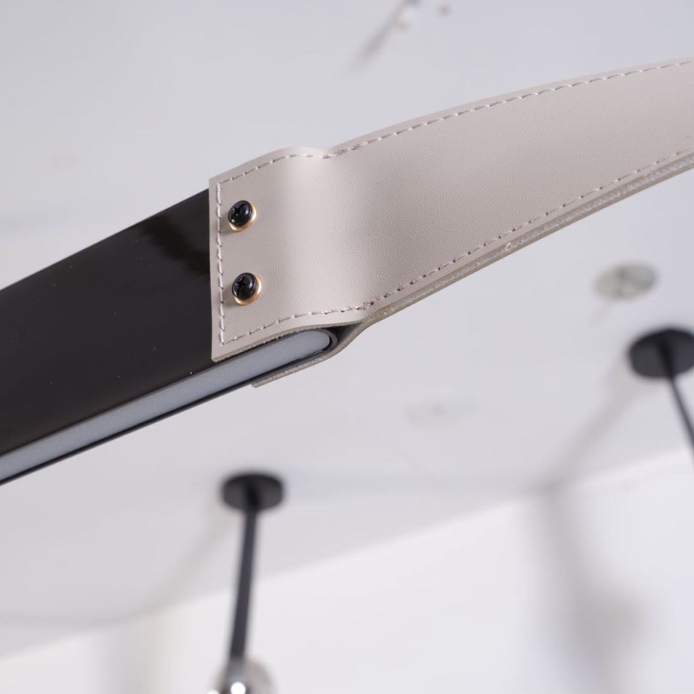 Black leather pendant lamp with comet-tail design, 1.5m length, by BEACON, showcasing modern pendant lighting style.