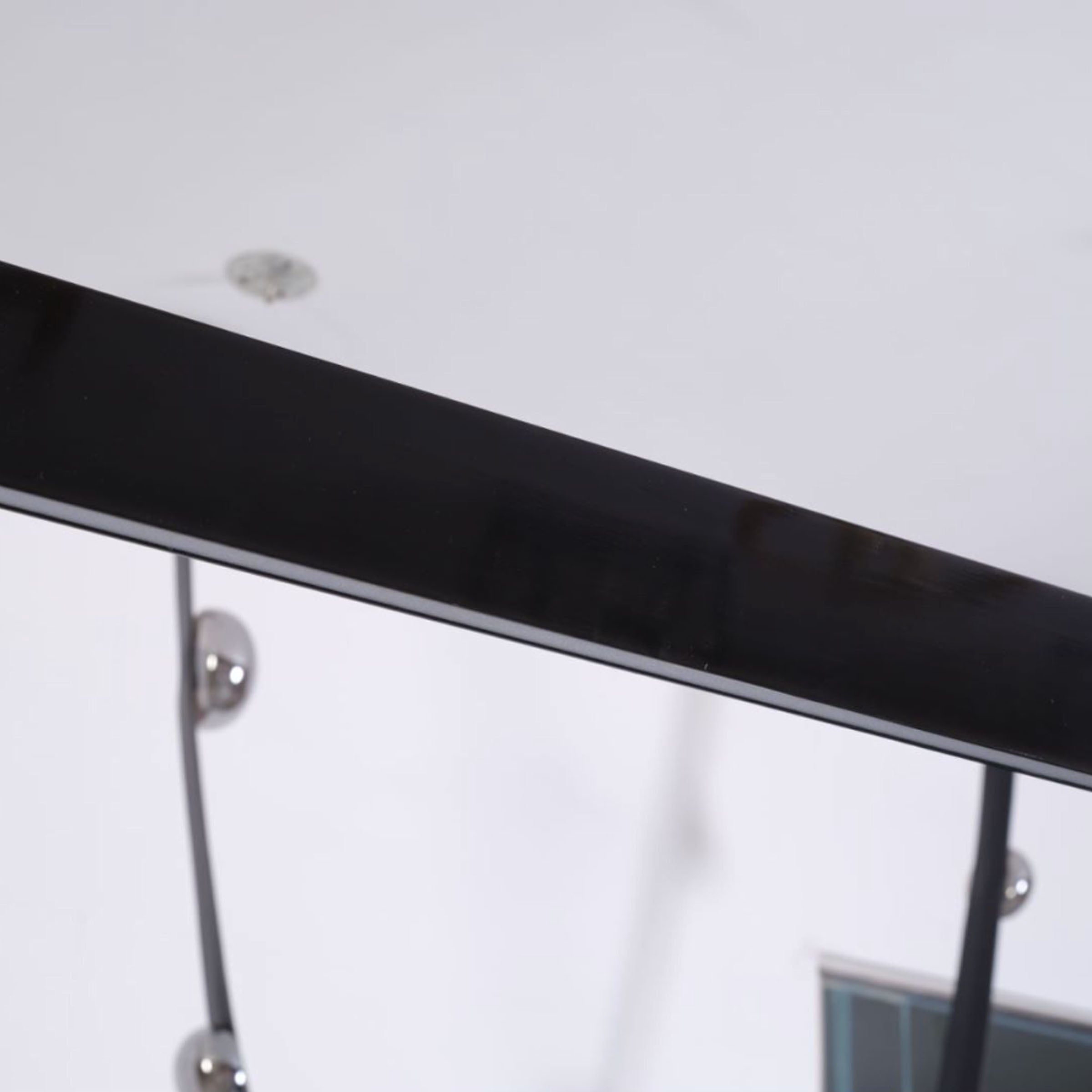 Black leather pendant lamp with comet tail design from BEACON, 1.5m length, modern lighting fixture for stylish interiors.