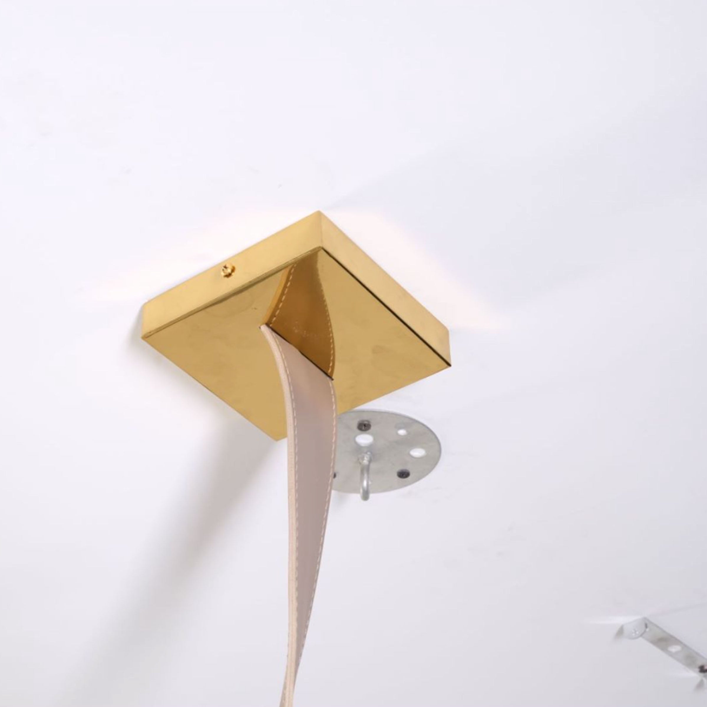 Beige leather and gold pendant lamp with a sleek comet tail design, 1.5m length by BEACON, perfect for modern interior decor.