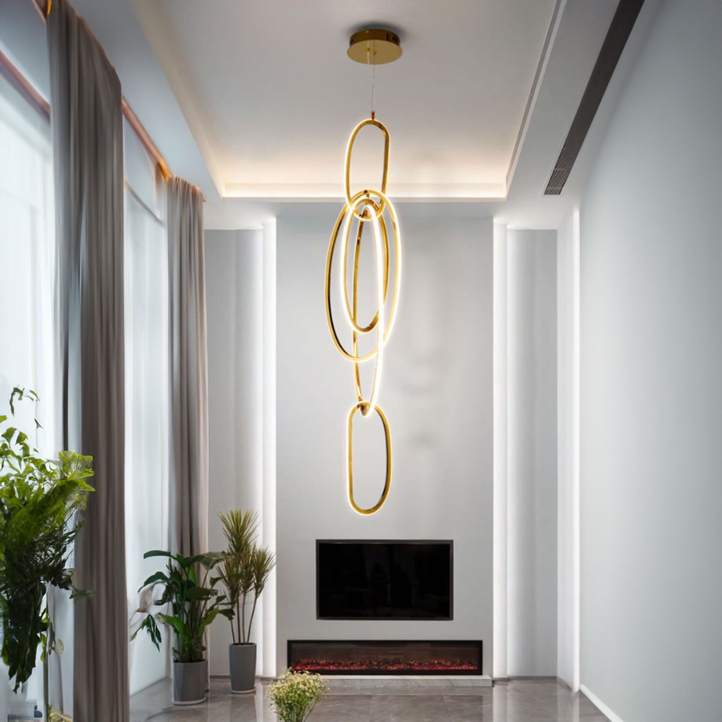 Golden pendant lamp with cosmic ring design from BEACON, featuring a modern, decorative lighting fixture for contemporary interiors.