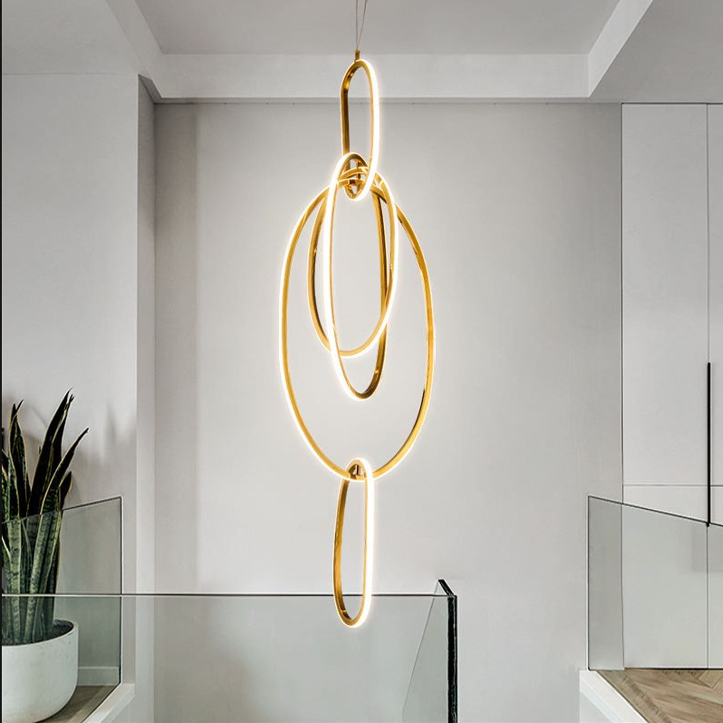 Golden Cosmic Rings Pendant Lamp by BEACON, modern pendant lighting fixture with a stylish celestial-inspired design.