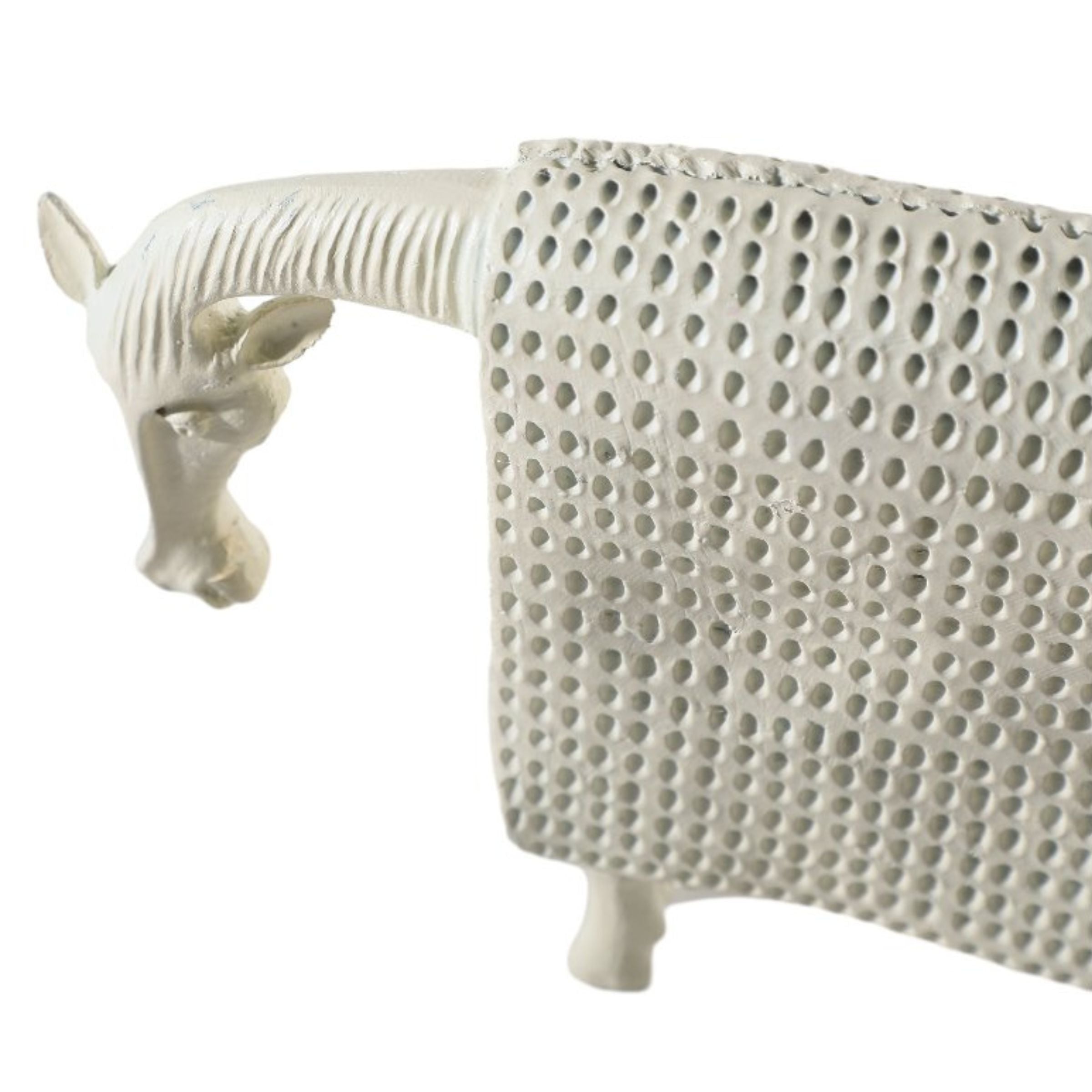 Decorative cow figurine from Beacon home decor collection, detailed animal sculpture for stylish interior accents.
