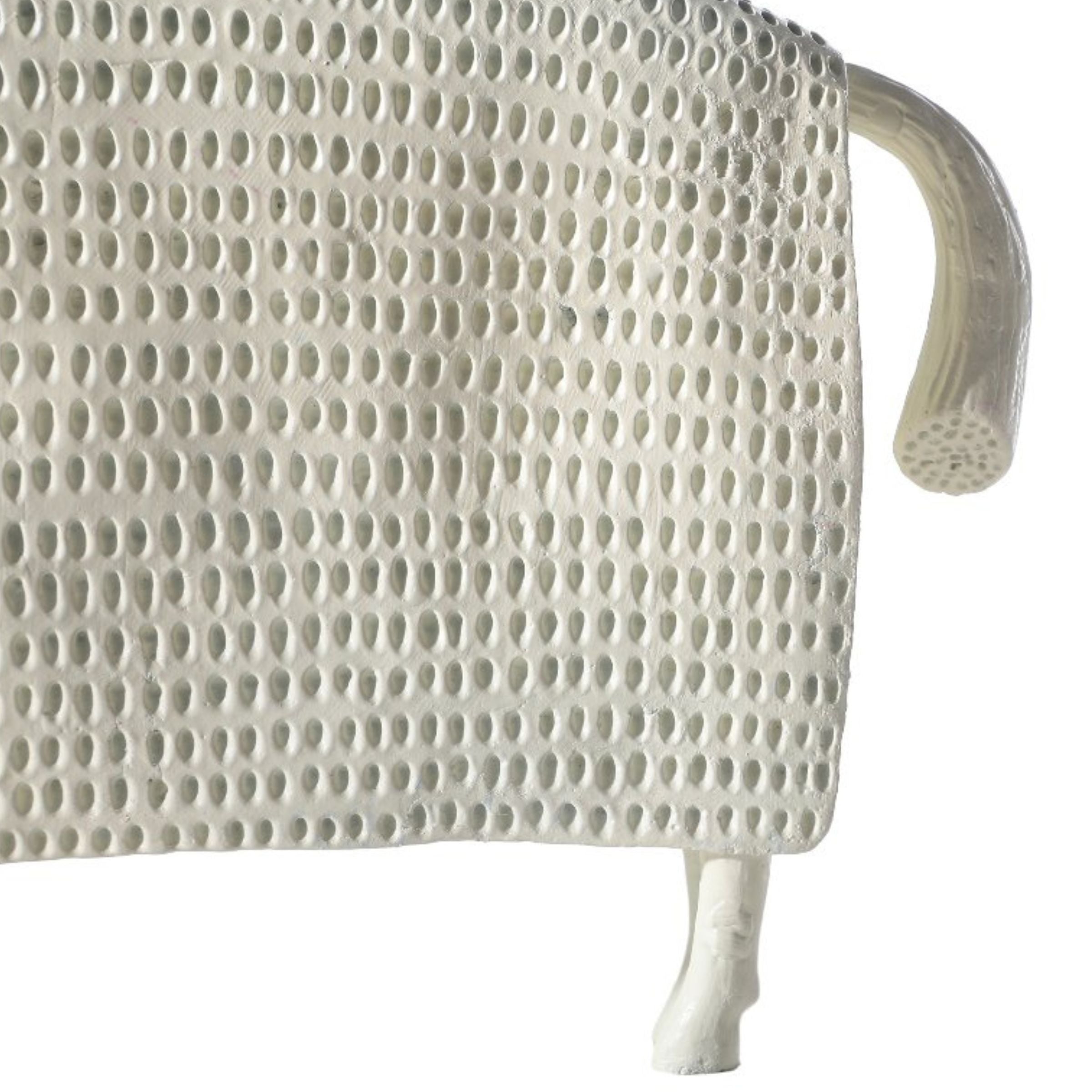 Beige cow figurine from Beacon home decor collection, detailed ceramic animal sculpture for decorative display.