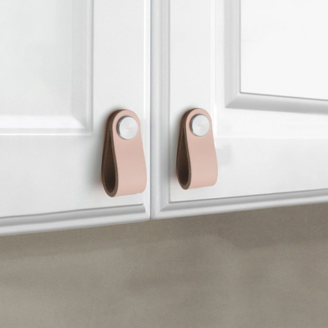 Cowhide layered door handle with stainless steel button knob by BEACON, featuring a textured cowhide surface and modern design.