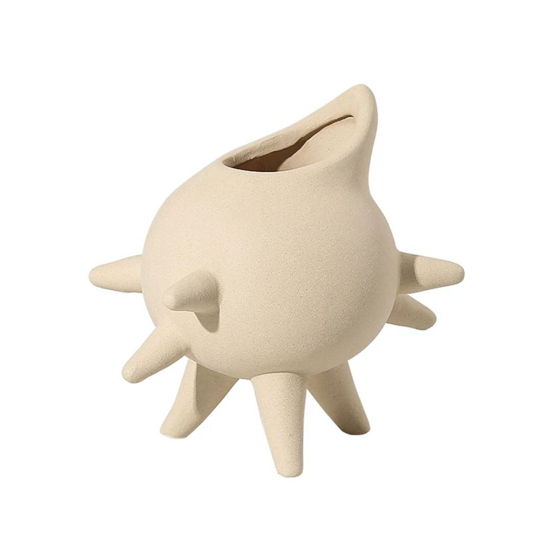 Cream ceramic vase with spike detail, designed by BEACON, featuring a modern, textured ceramic finish for stylish home decor.