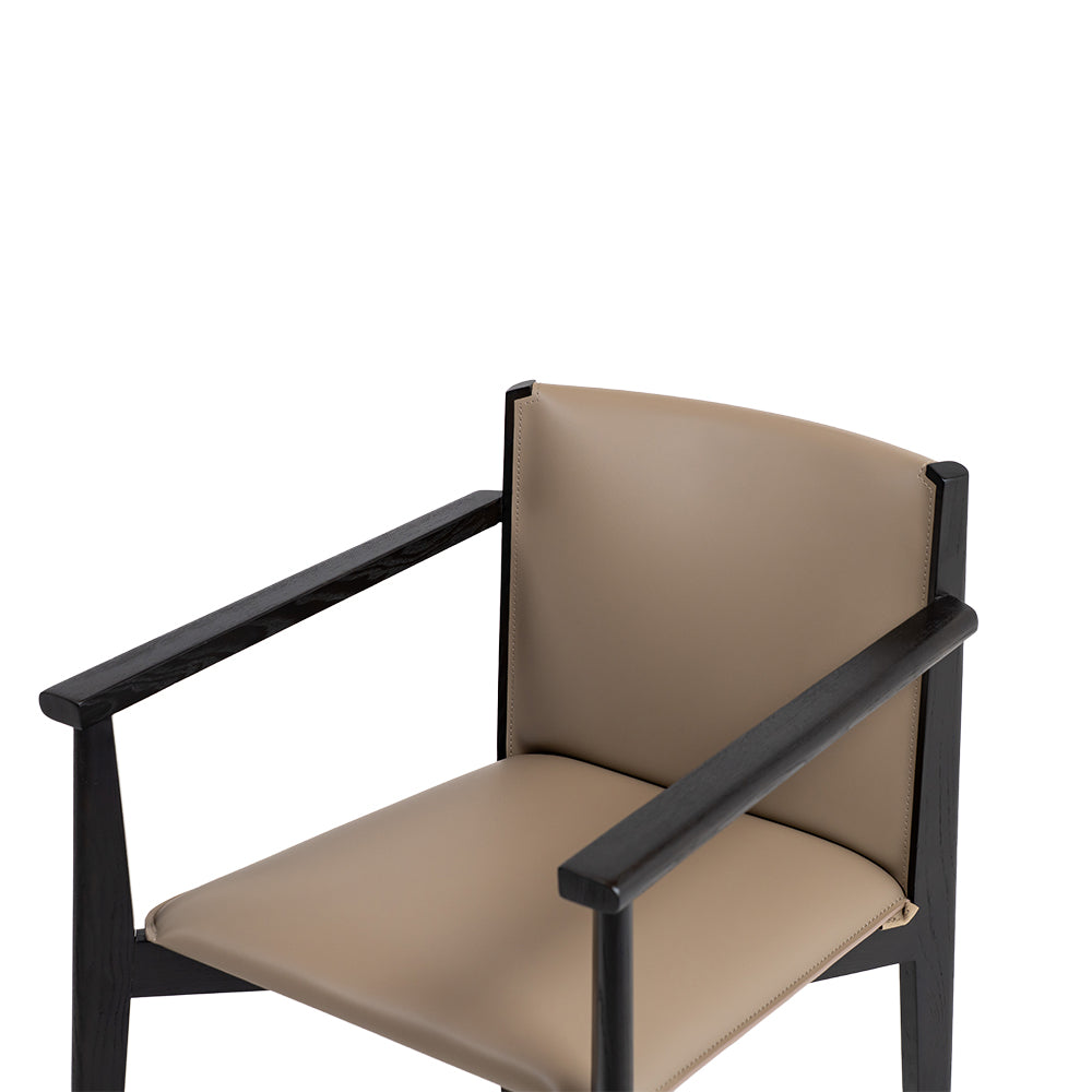 Dark saddle leather arm dining chair with wooden legs, stylish and comfortable, designed by BEACON.