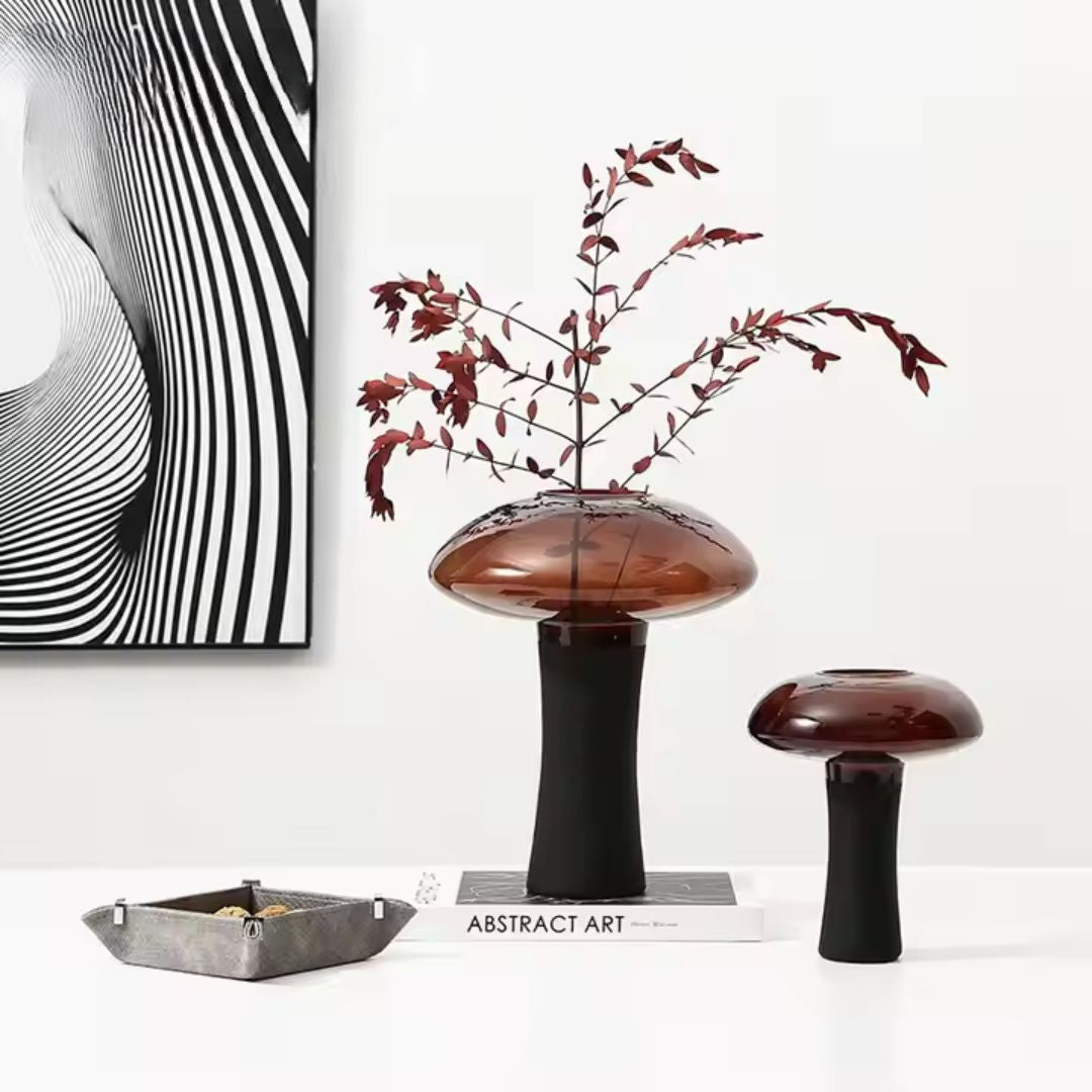 Medium deep amber and black glass bud vase with stem by BEACON, perfect for floral arrangements and decorative displays.
