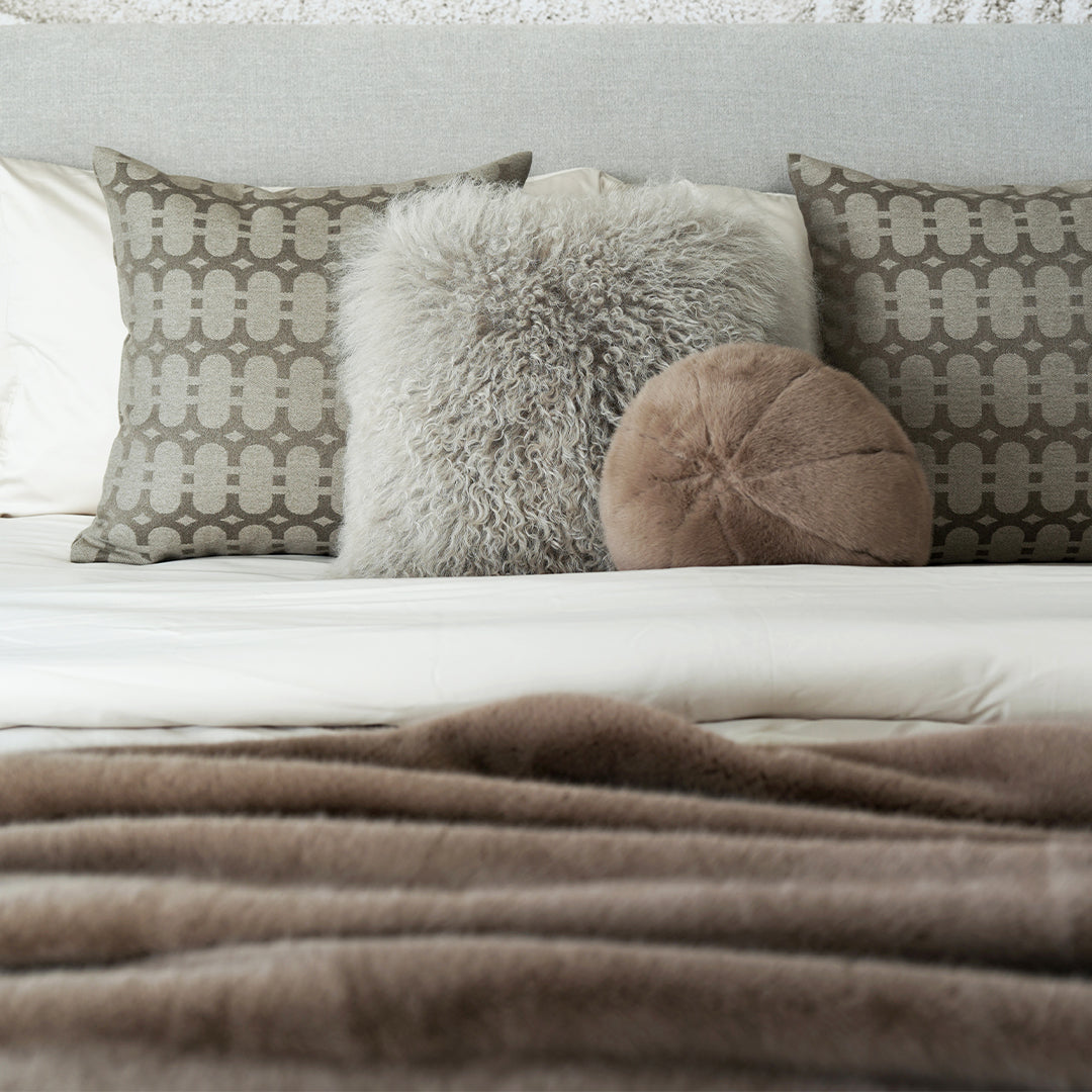 Delton bedding set by BEACON, featuring a cozy, patterned bedding design with pillows and sheets in neutral tones.