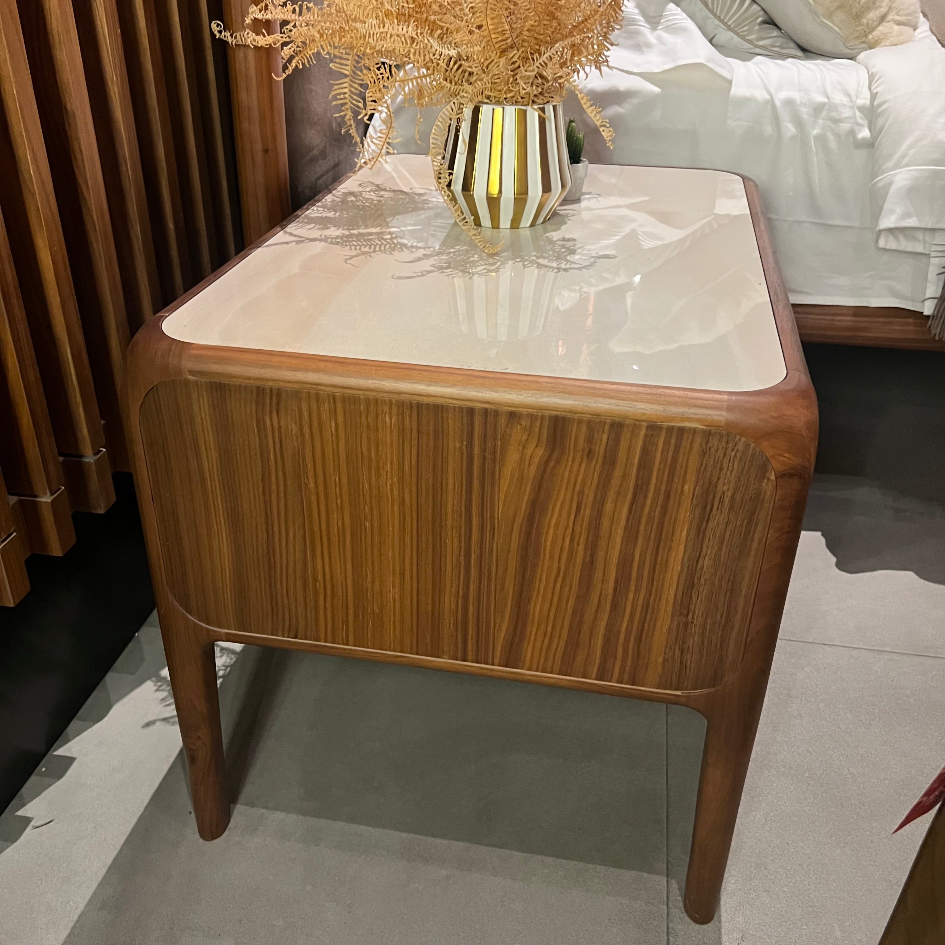 Two Nakheel Icon bedside tables by HOMAGE KOLTUK, showcasing modern design with wood finish and sleek drawer handles.