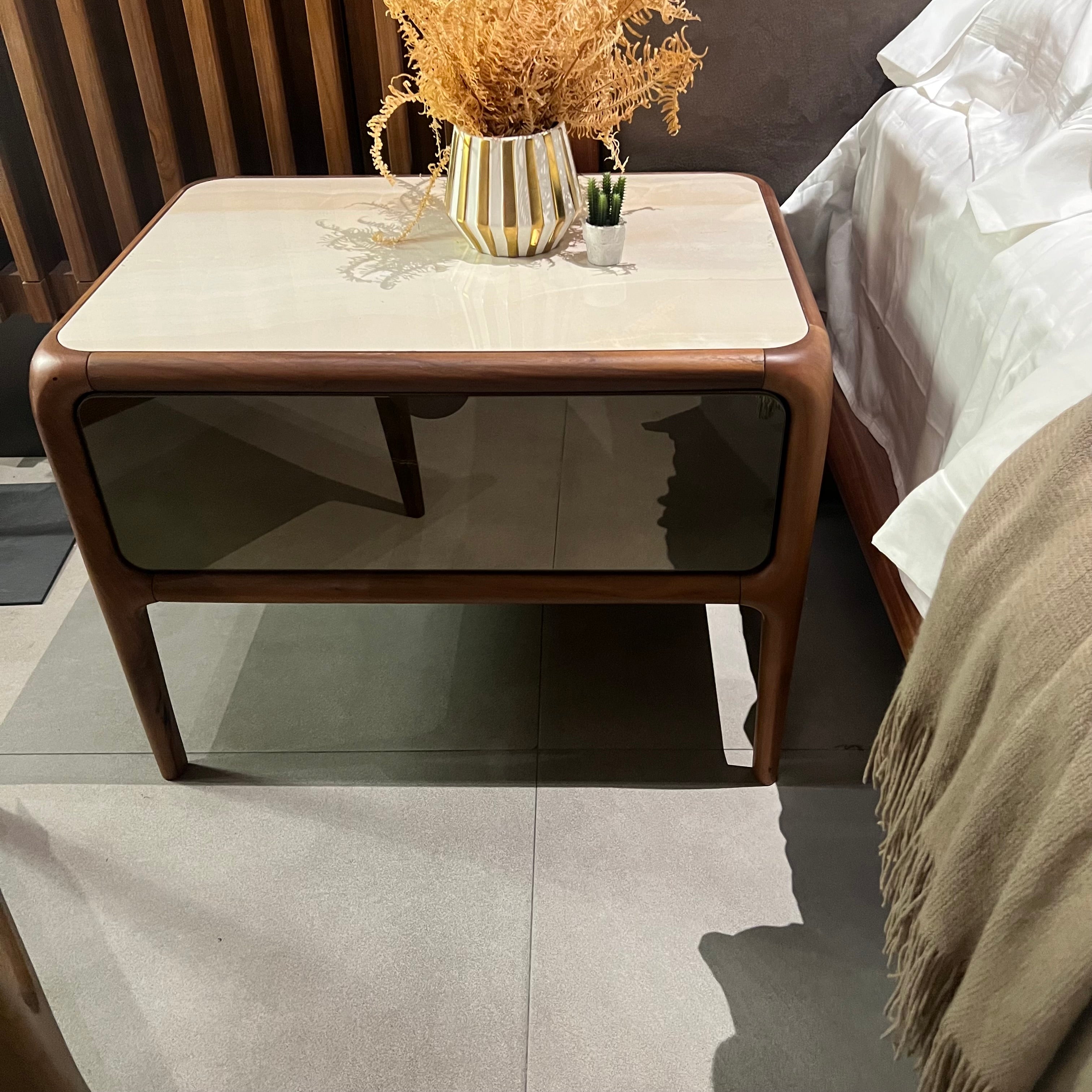 Display image of two Icon bedside tables by Nakheel, featuring modern wooden design and sleek tabletop surface.