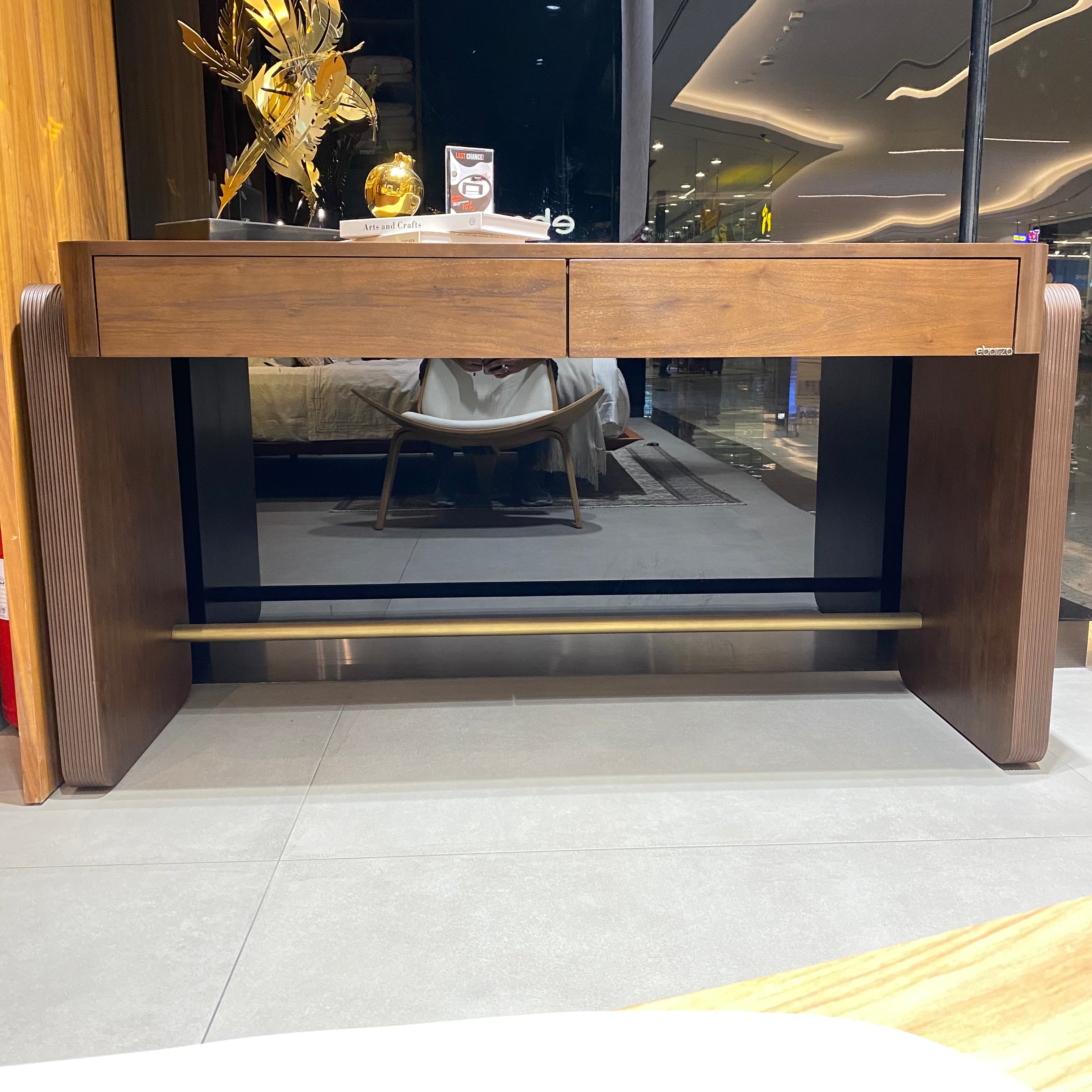 Amber desk display item by LODA Furniture, showcasing a sleek, modern wooden desk with a warm amber finish.