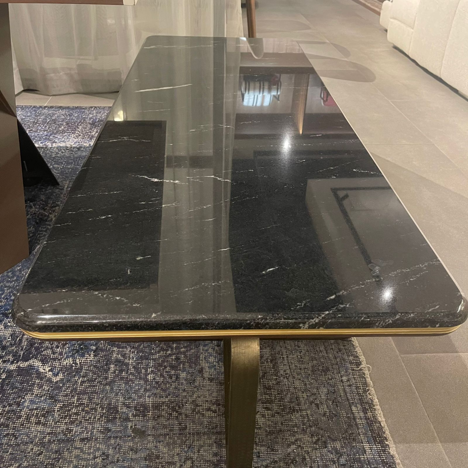 Amber marble center table from LODA Furniture, display item showcasing a sleek, modern design with a polished marble surface.