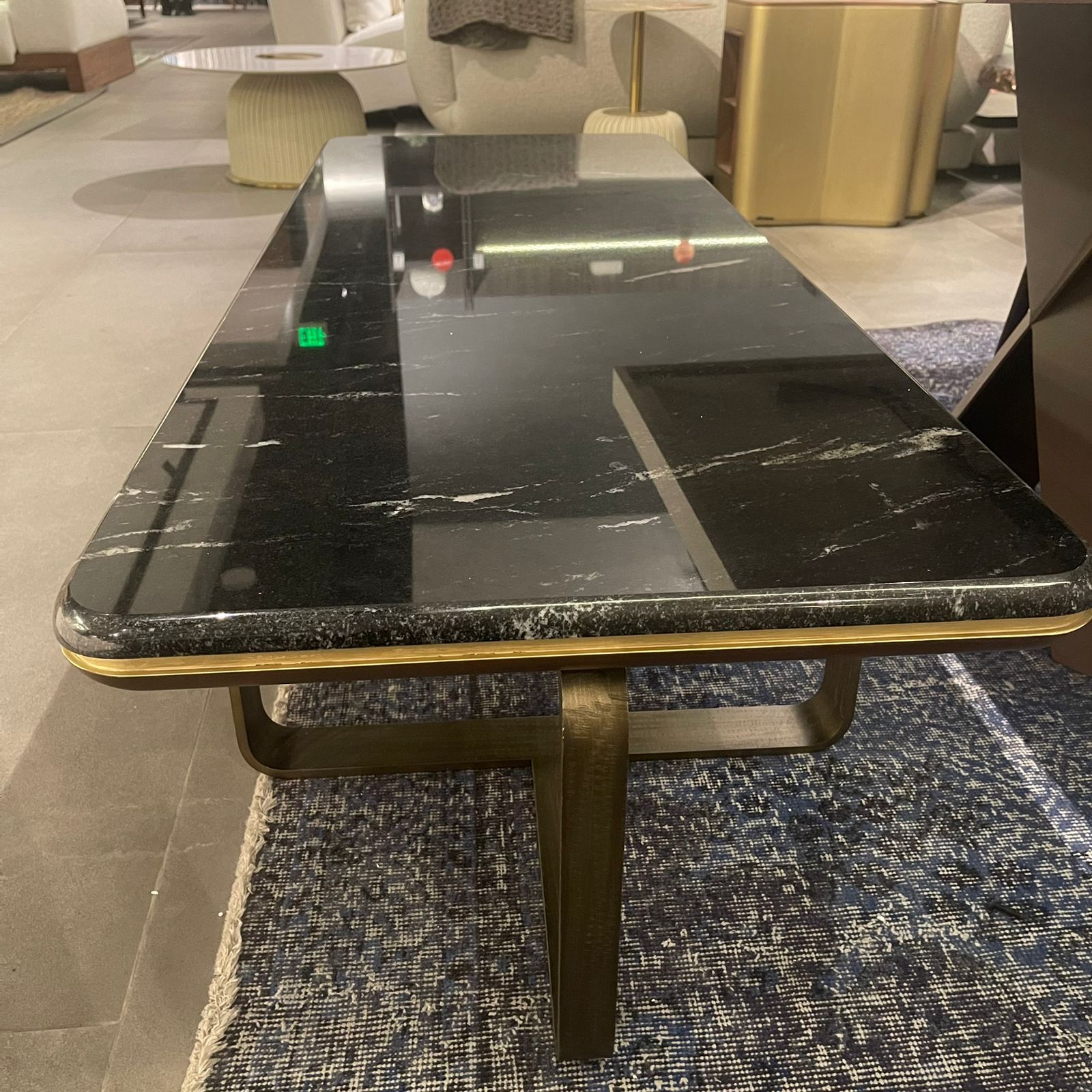 Amber marble center table from LODA Furniture, stylish display item with a sleek design and polished marble surface.