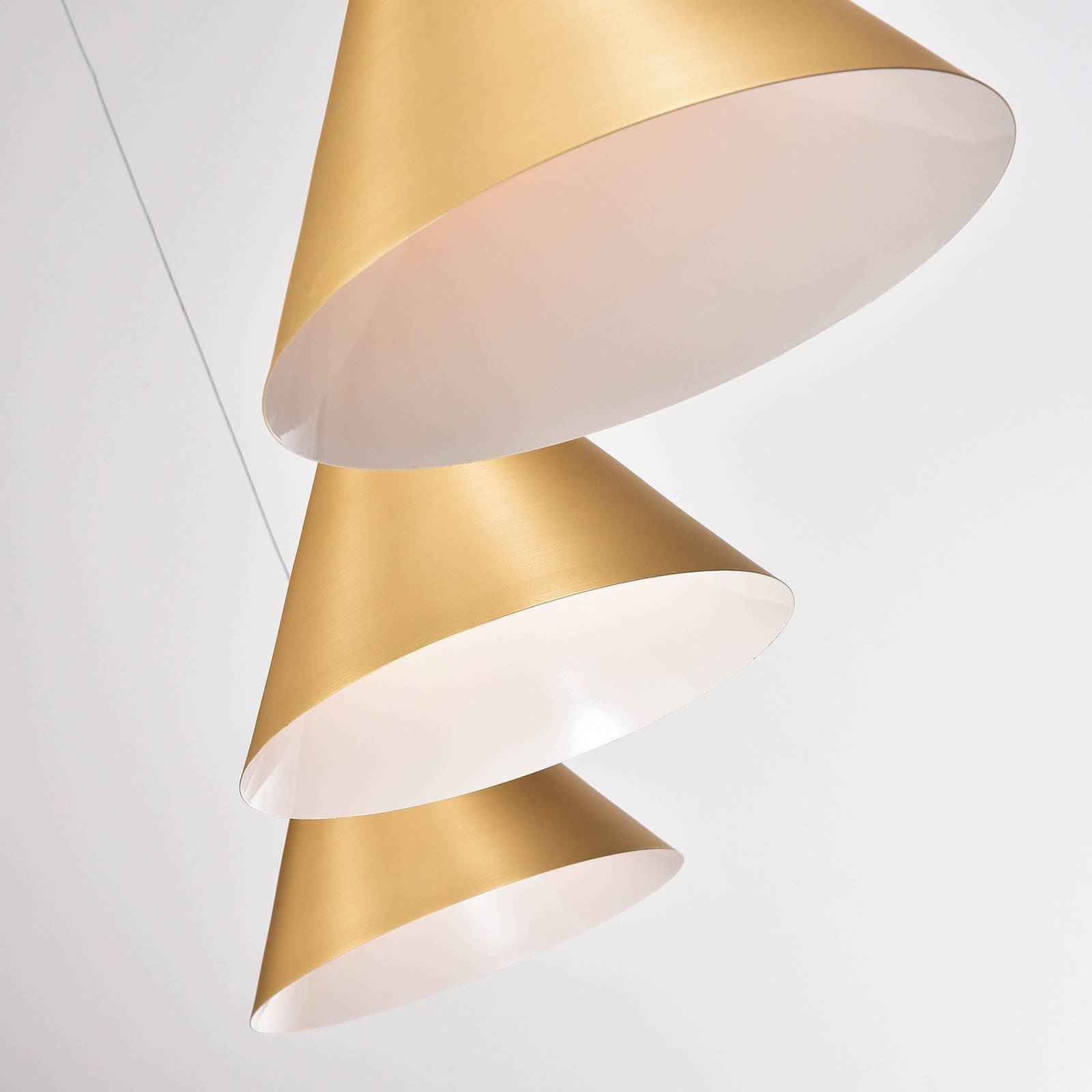 Display of the Andria 3 Heads Pendant Lamp by Beacon, featuring sleek pendant lights with modern design.