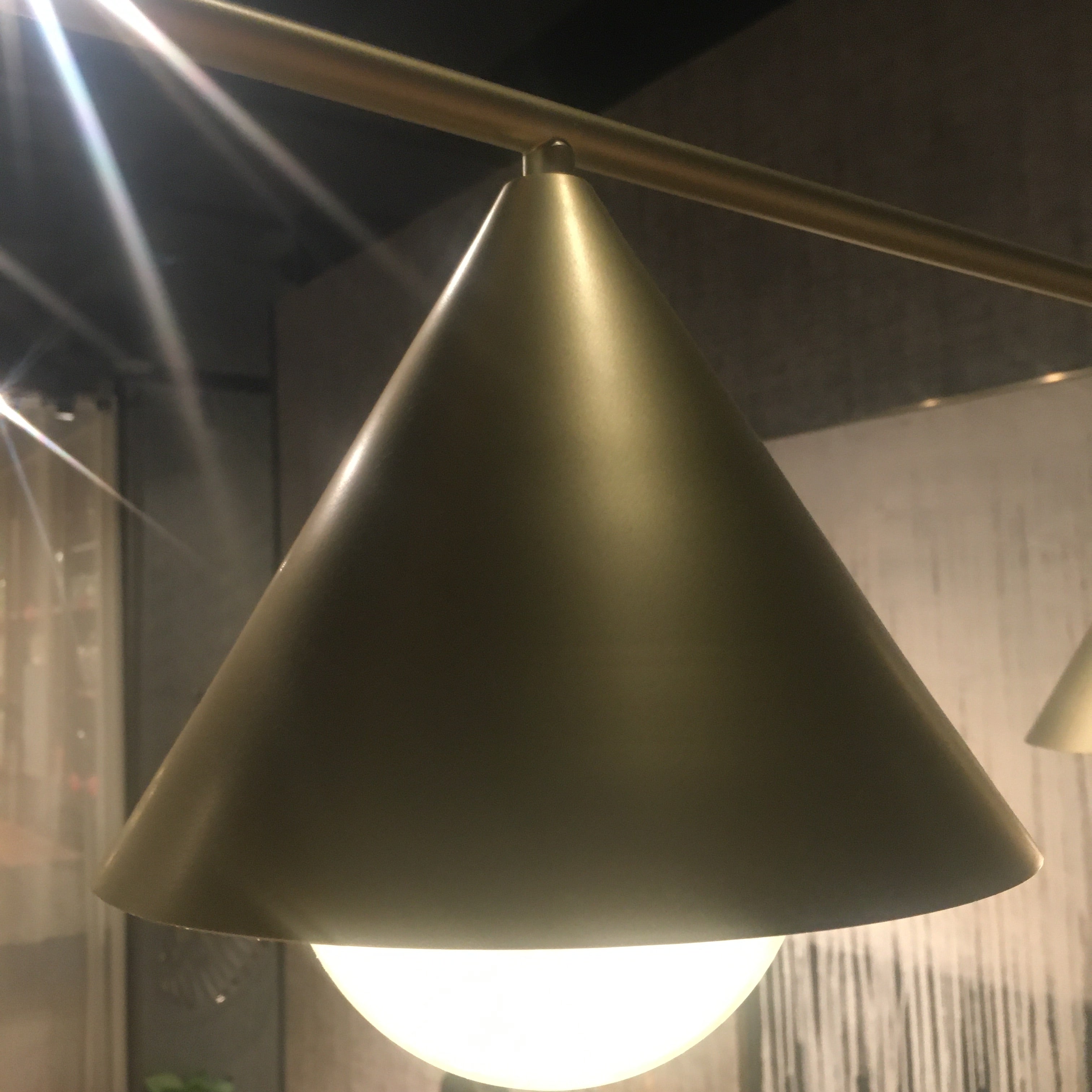 Display of the Andria 3 Heads Pendant Lamp by Beacon, featuring three hanging light fixtures with a modern design.