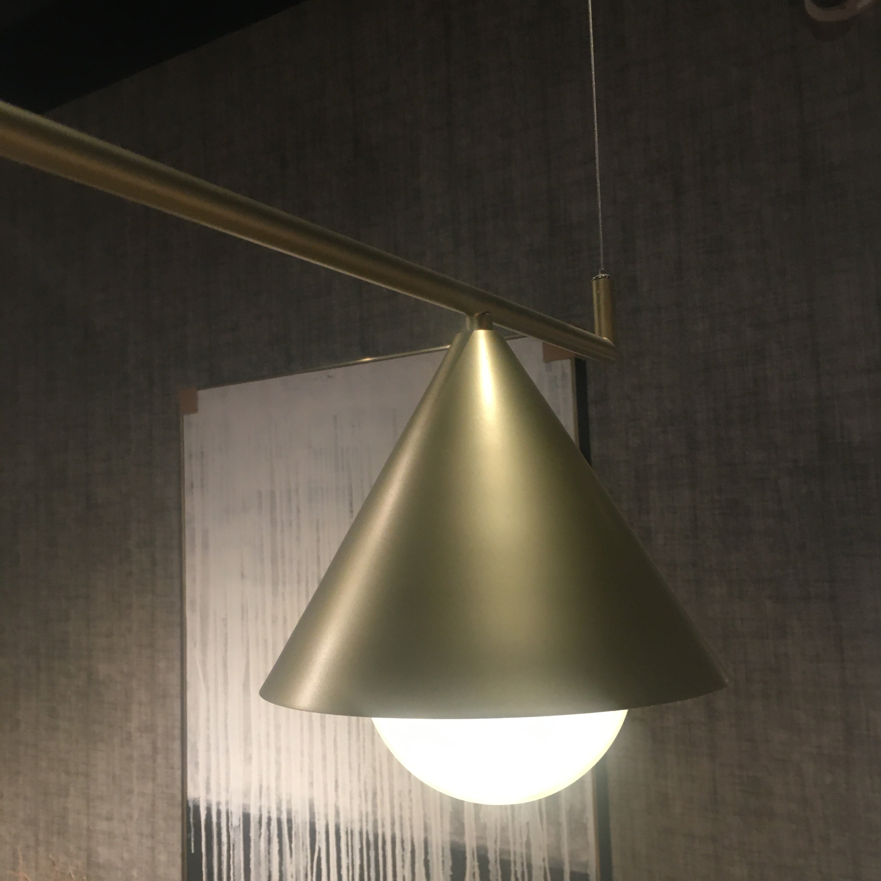 Display of the Andria 3 Heads Pendant Lamp by Beacon, showing its modern design with three hanging light fixtures.