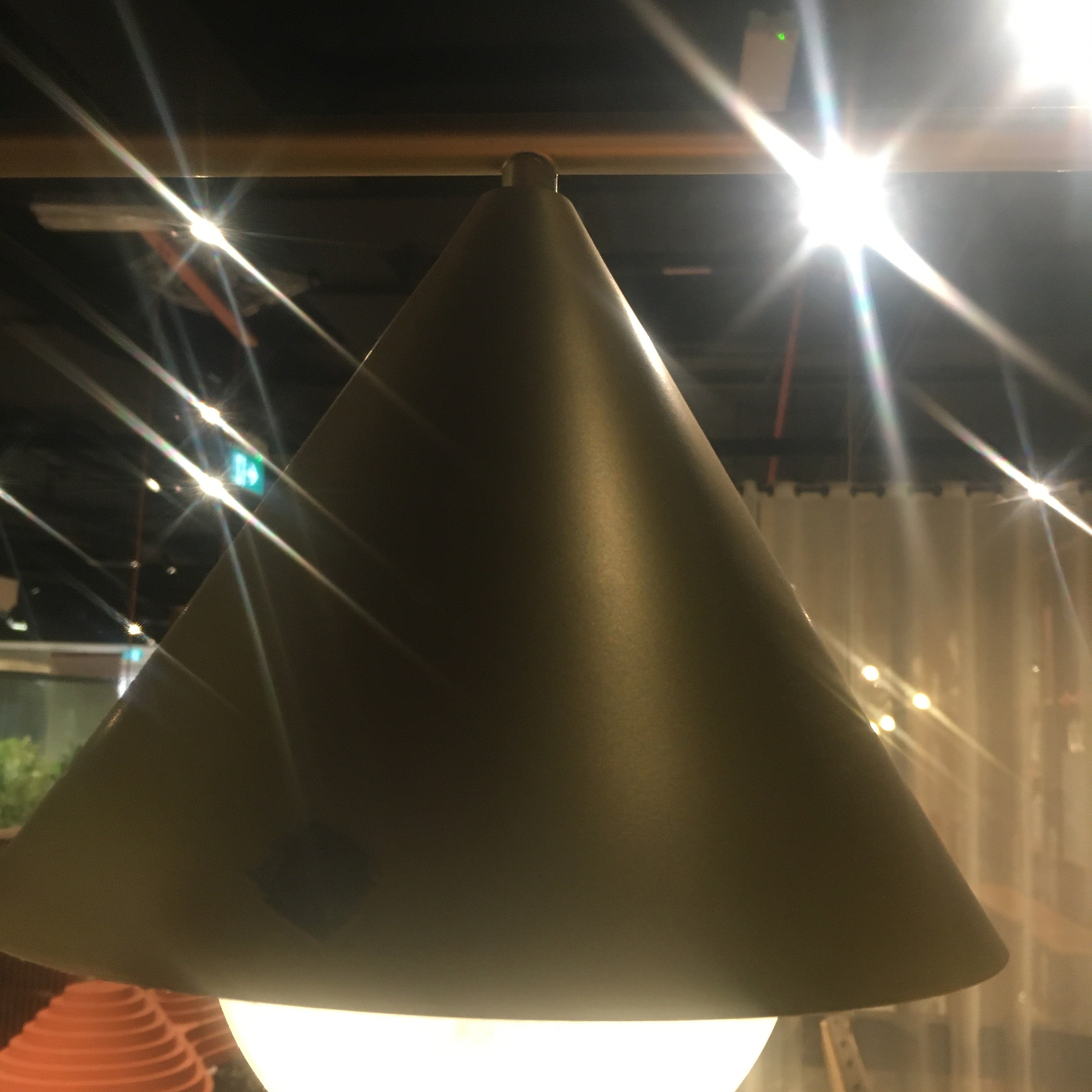 Display of the Andria 3 Heads Pendant Lamp by Beacon, showcasing its modern design and three hanging light fixtures.