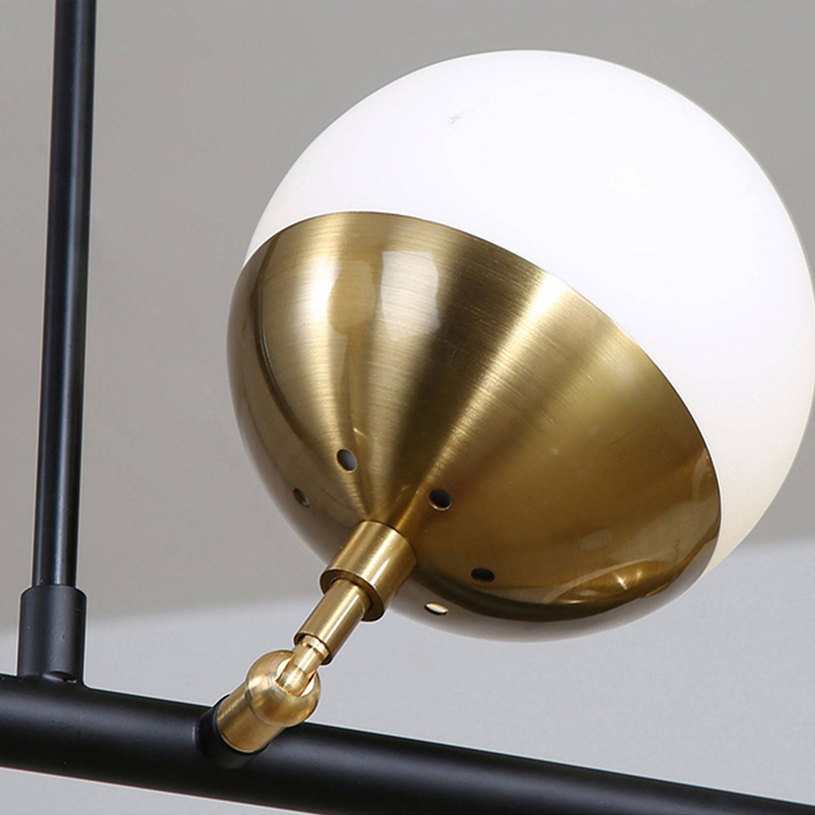 Display of Arvika 6 Heads Pendant Lamp by BEACON, showcasing modern pendant light with six adjustable heads on a sleek fixture.