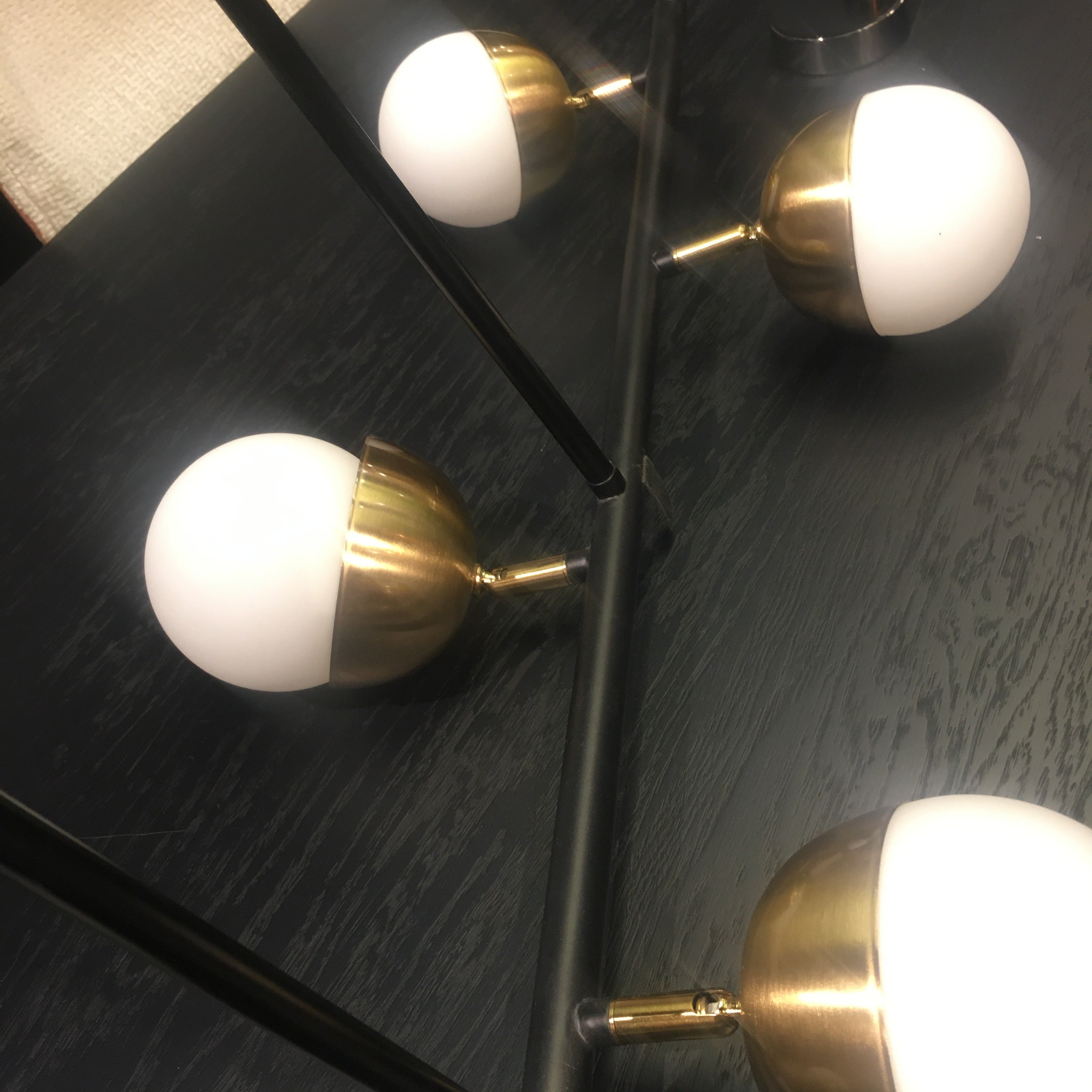 Display of Arvika 6 Heads Pendant Lamp by BEACON, showcasing its modern design and six hanging light fixtures.