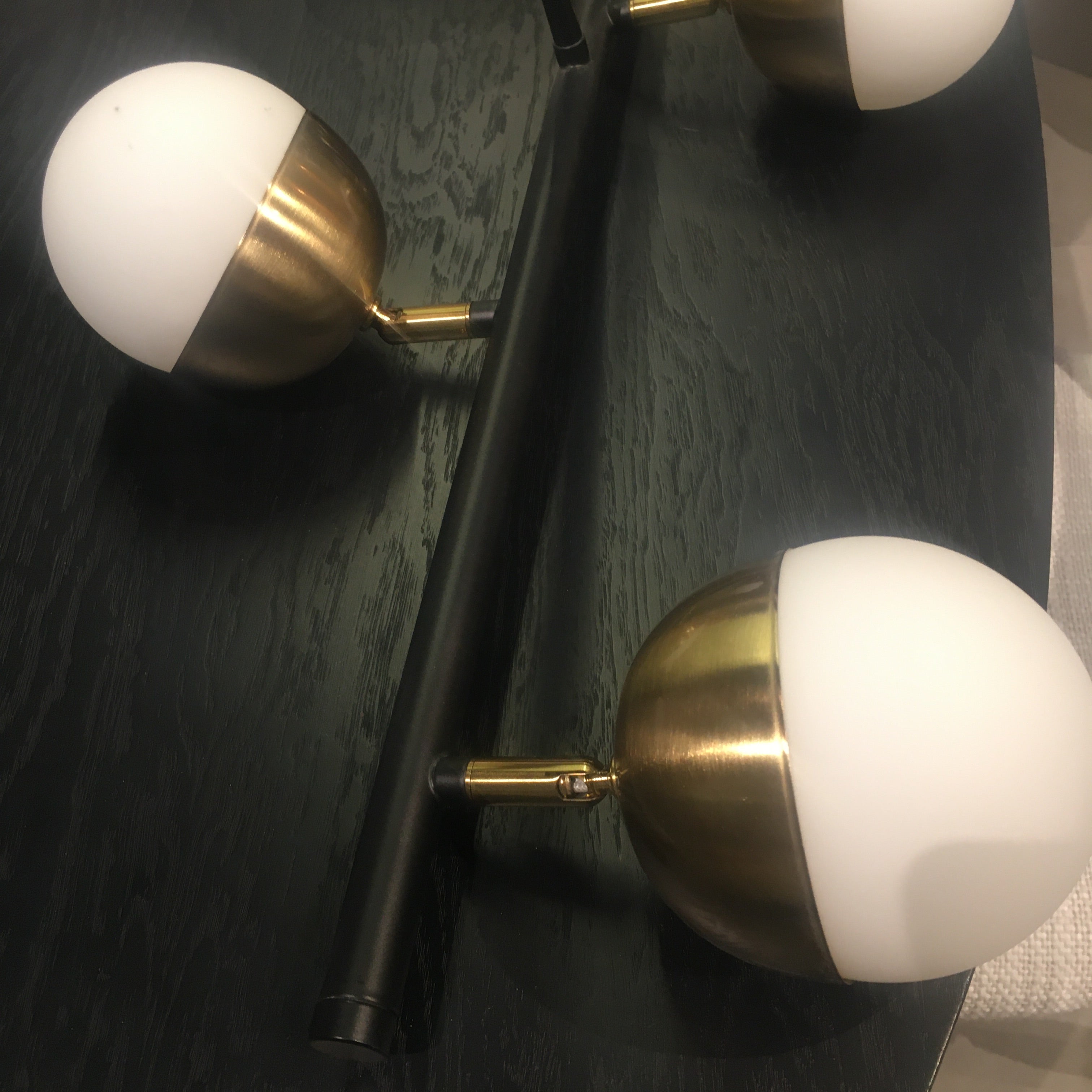 Display of the Arvika 6 Heads Pendant Lamp by BEACON, showcasing its modern design with six hanging light fixtures.