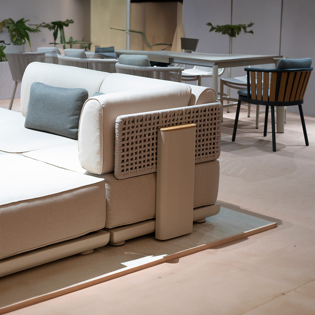 BEACON outdoor block pouf in neutral fabric, versatile seating or footrest, shown in outdoor setting with modern design.