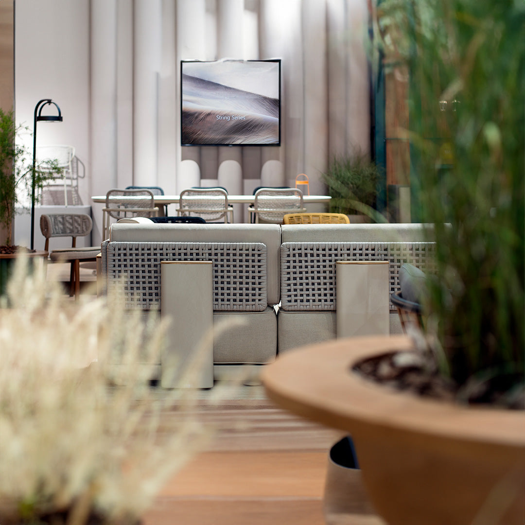 Outdoor beige BEACON block pouf with a soft fabric surface, perfect for patio or garden seating.