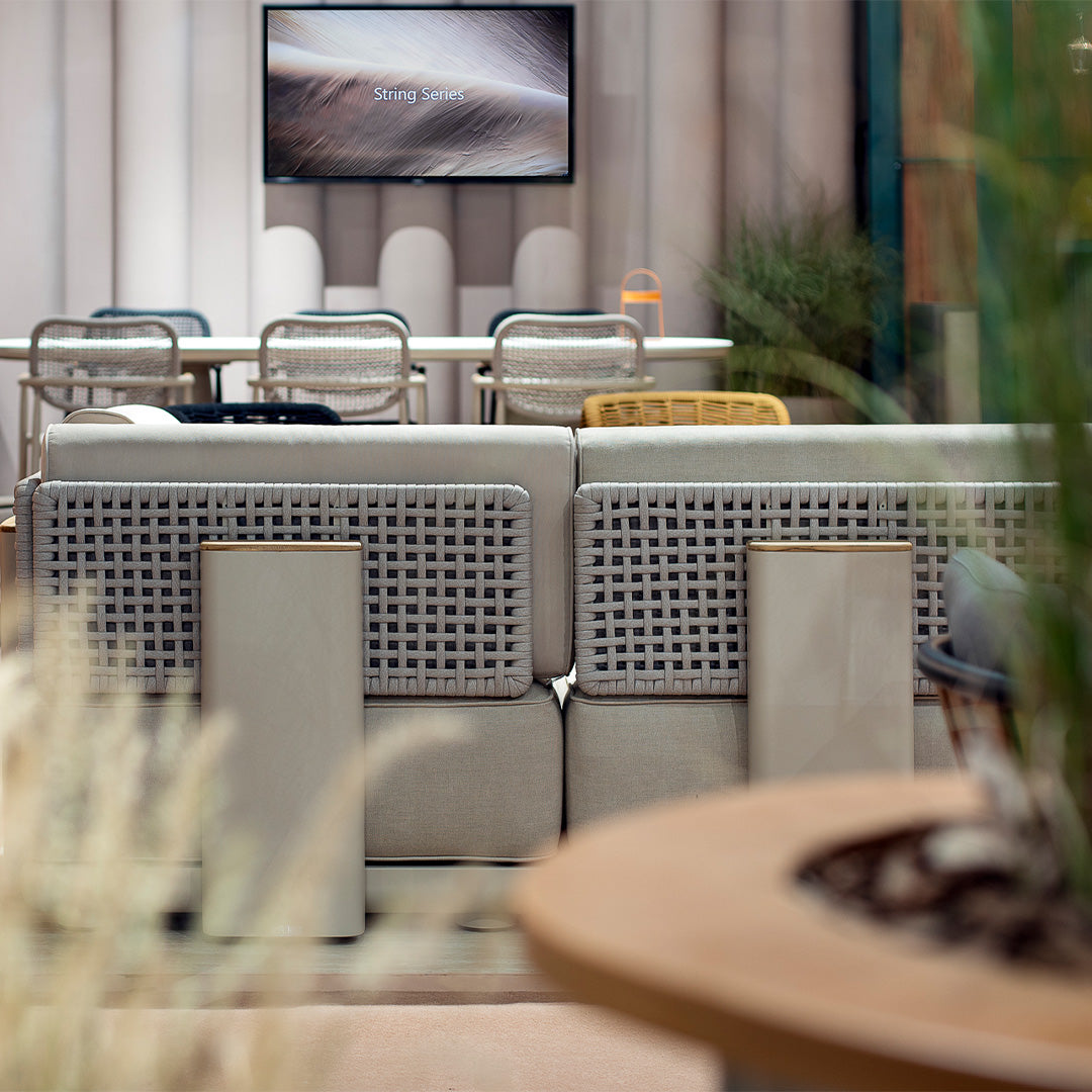 BEACON outdoor block pouf in neutral fabric, versatile seating or footrest, with a modern, cube-shaped design.