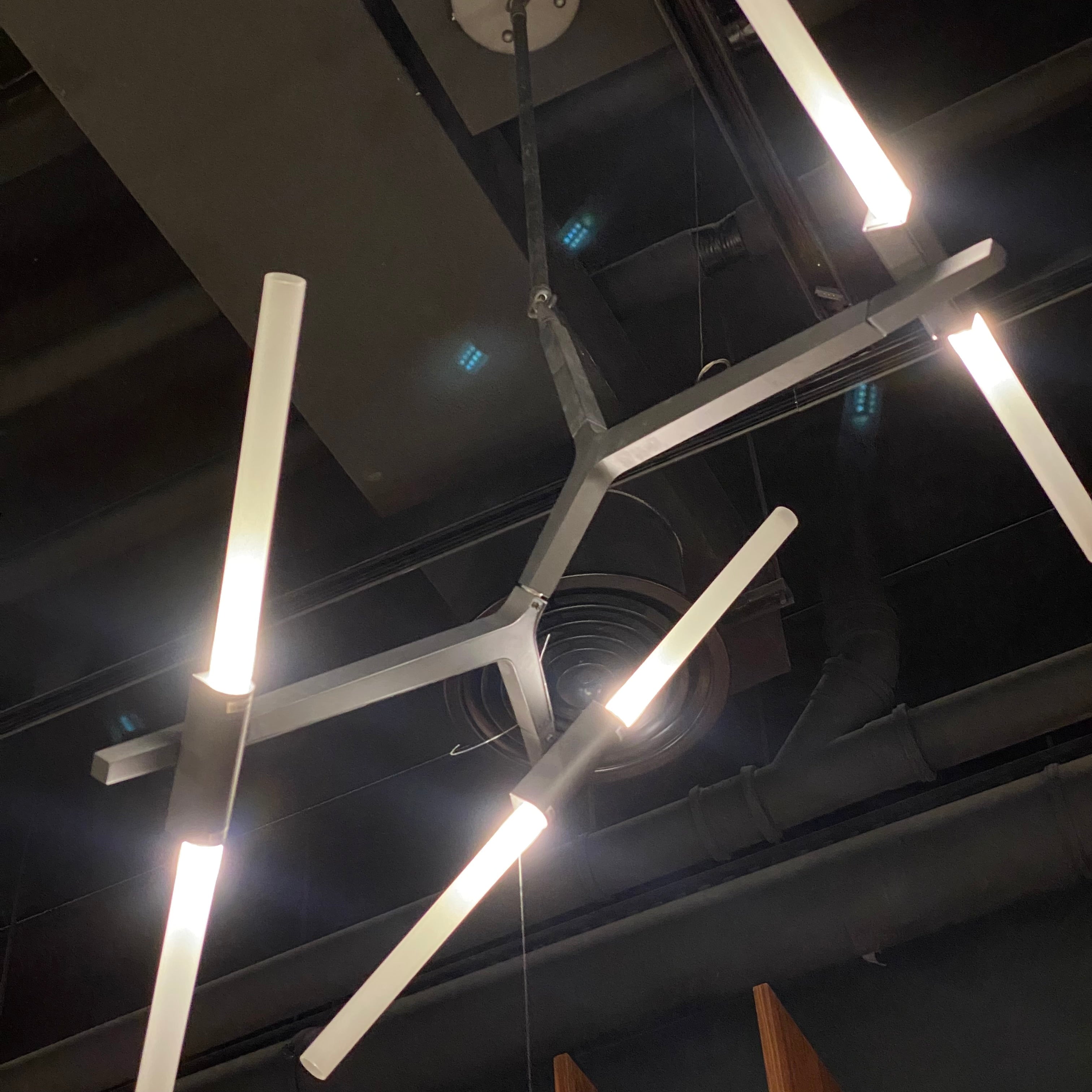Display of BEACON 6-head branch chandelier pendant lamp with modern design and brass finish.