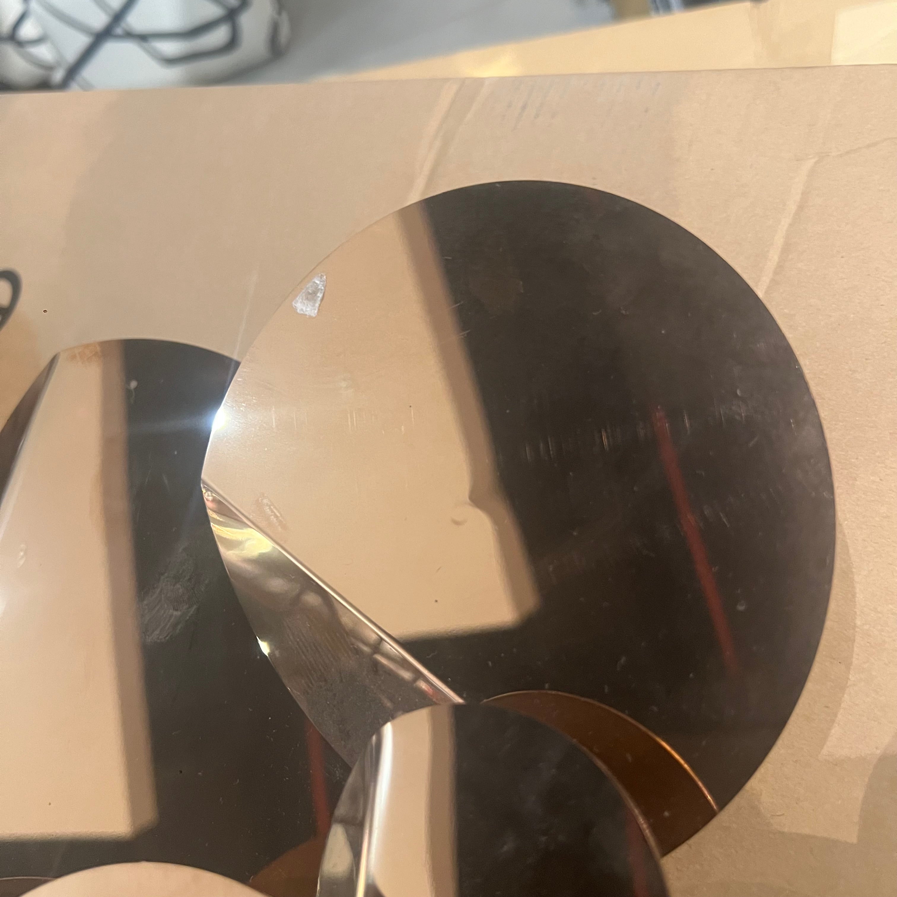 Handcrafted stainless steel artwork featuring bubble designs, displayed as an elegant decorative item by BEACON.