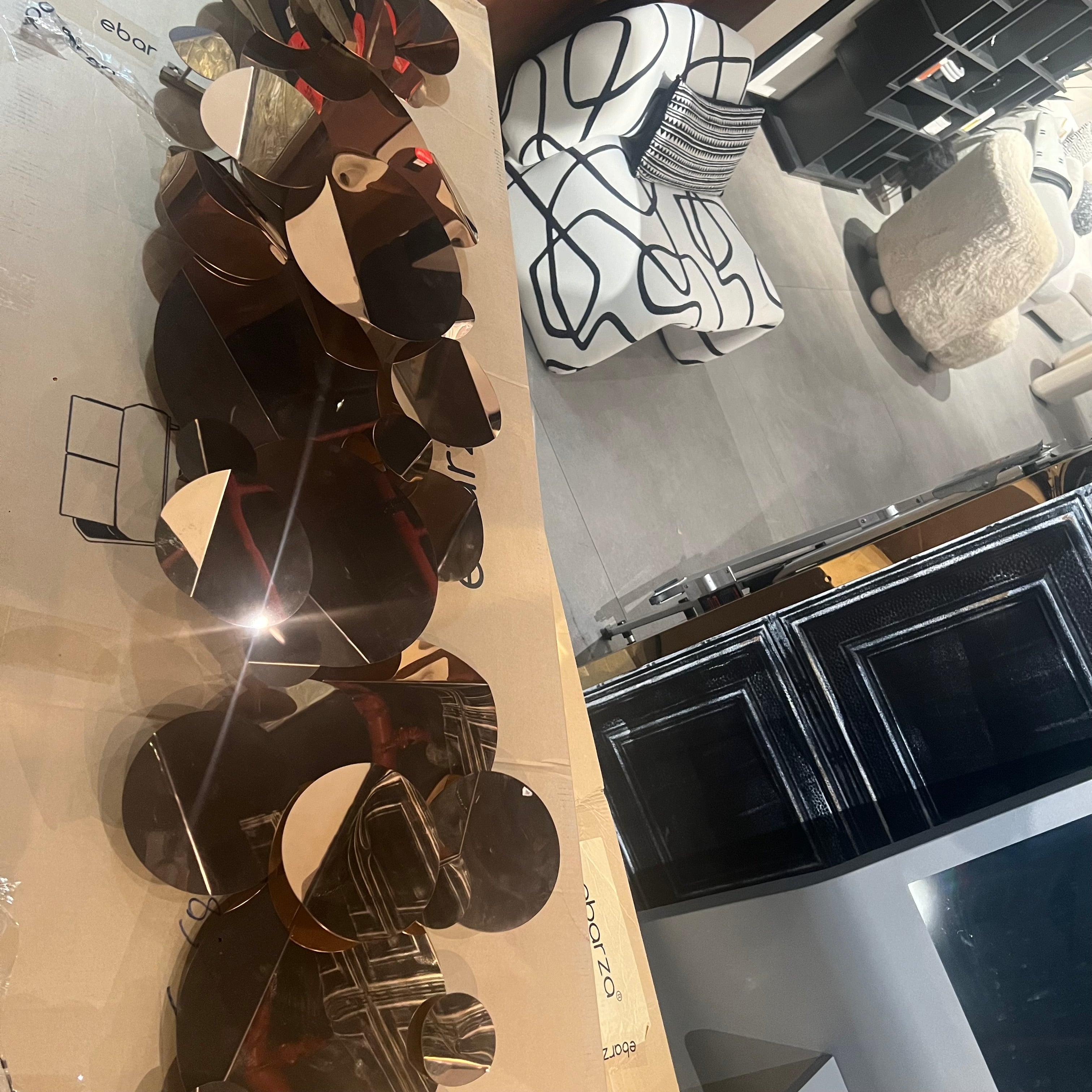 Handcrafted stainless steel artwork featuring bubble design, displayed as a decorative item by BEACON BZDG.