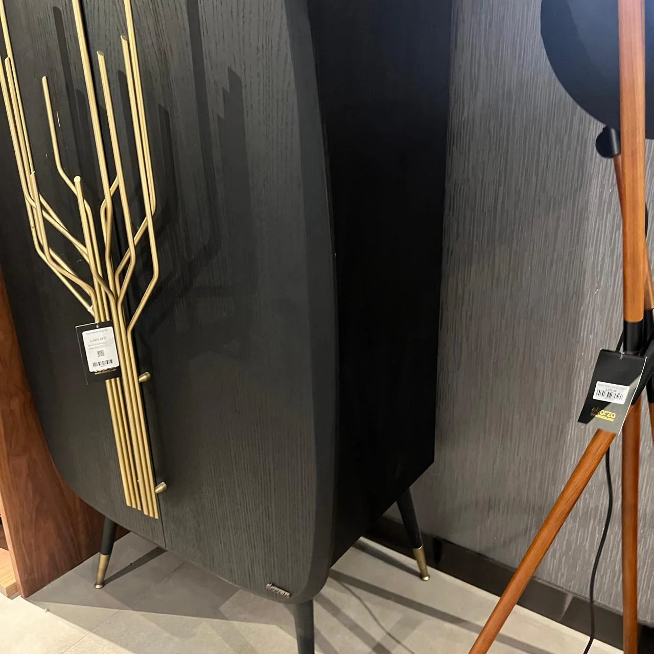 Display image of a Bug Cabinet by LODA Furniture, showing a wooden storage cabinet with glass doors and multiple shelves.