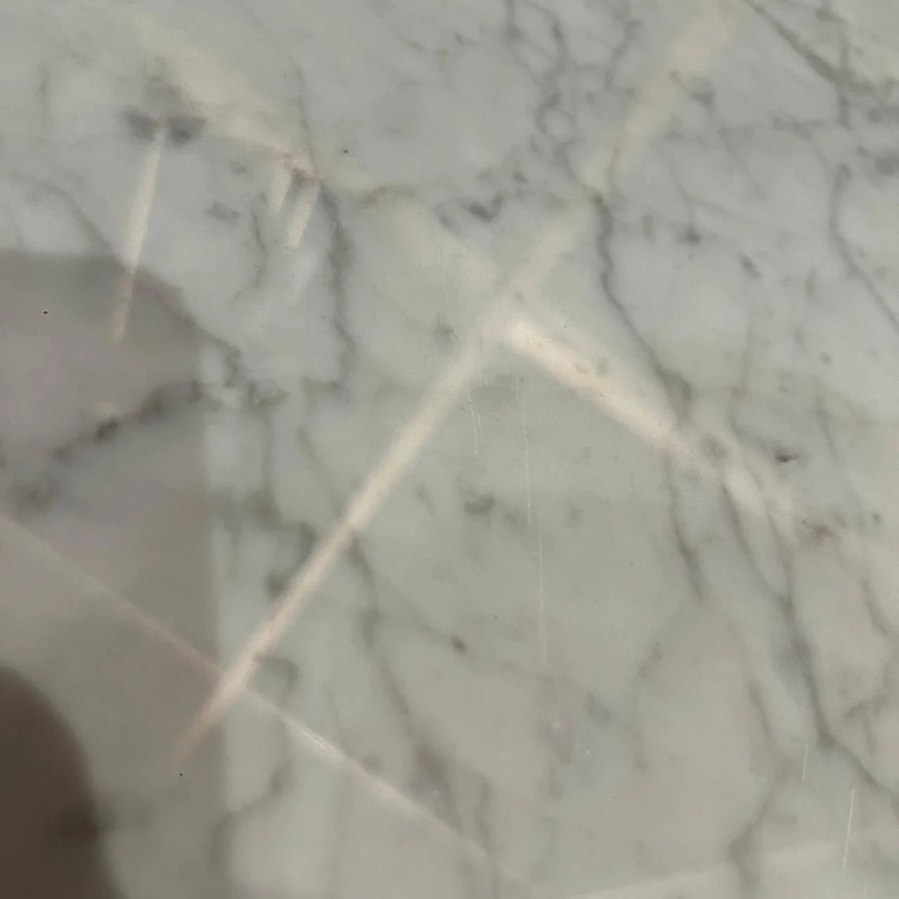 Carrara marble coffee table by Beacon, featuring a sleek rectangular design with elegant white marble surface and modern style.