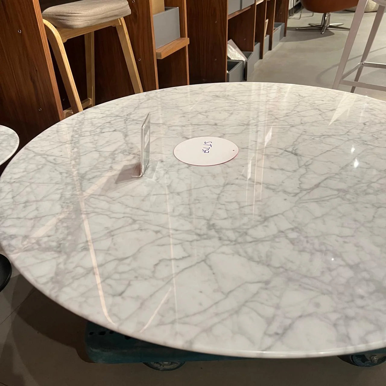 Display of Carrara marble coffee table by Beacon, showcasing its elegant white marble surface and modern design.