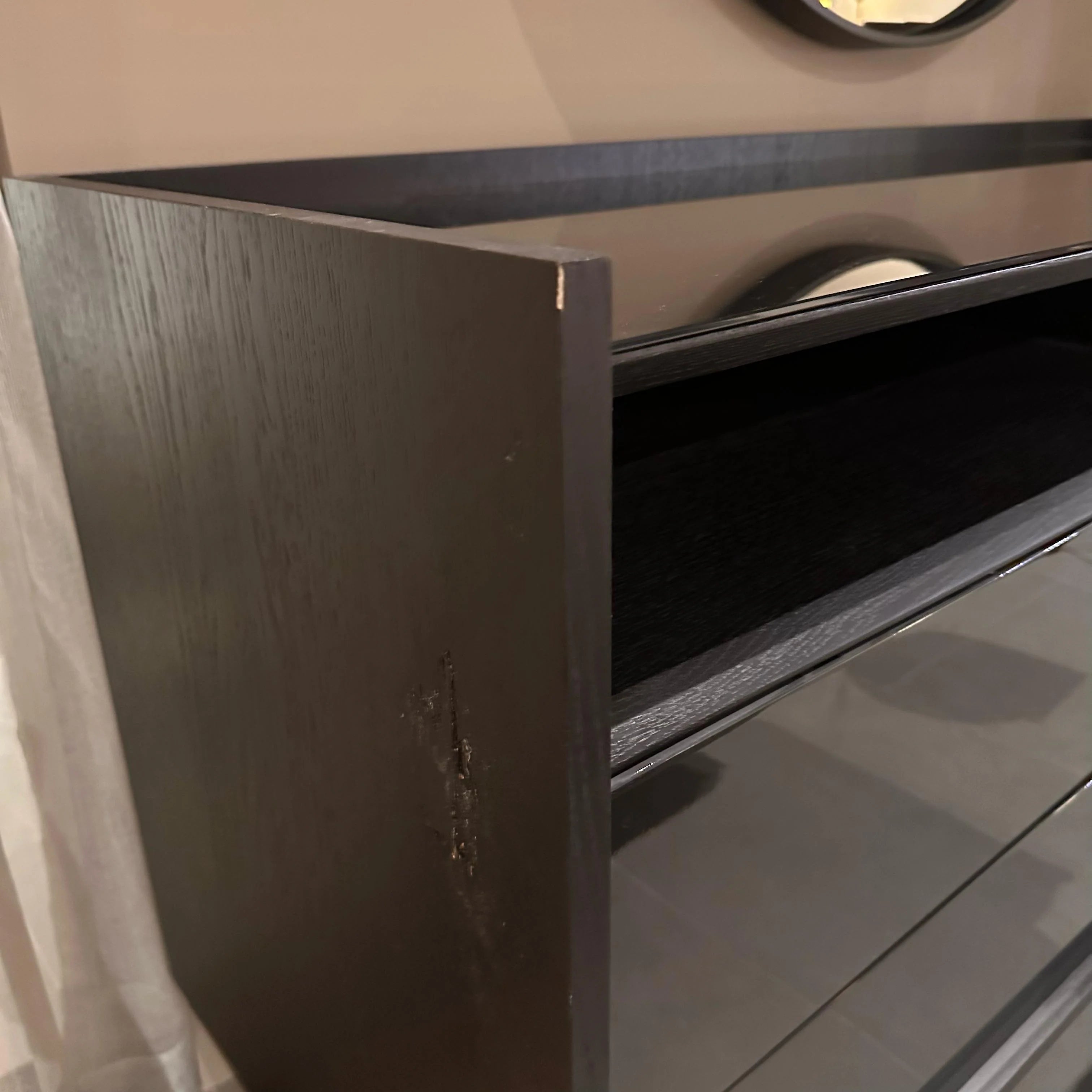 Display of a grey dresser and matching mirror from YOL LIVING collection, showcasing modern bedroom furniture.