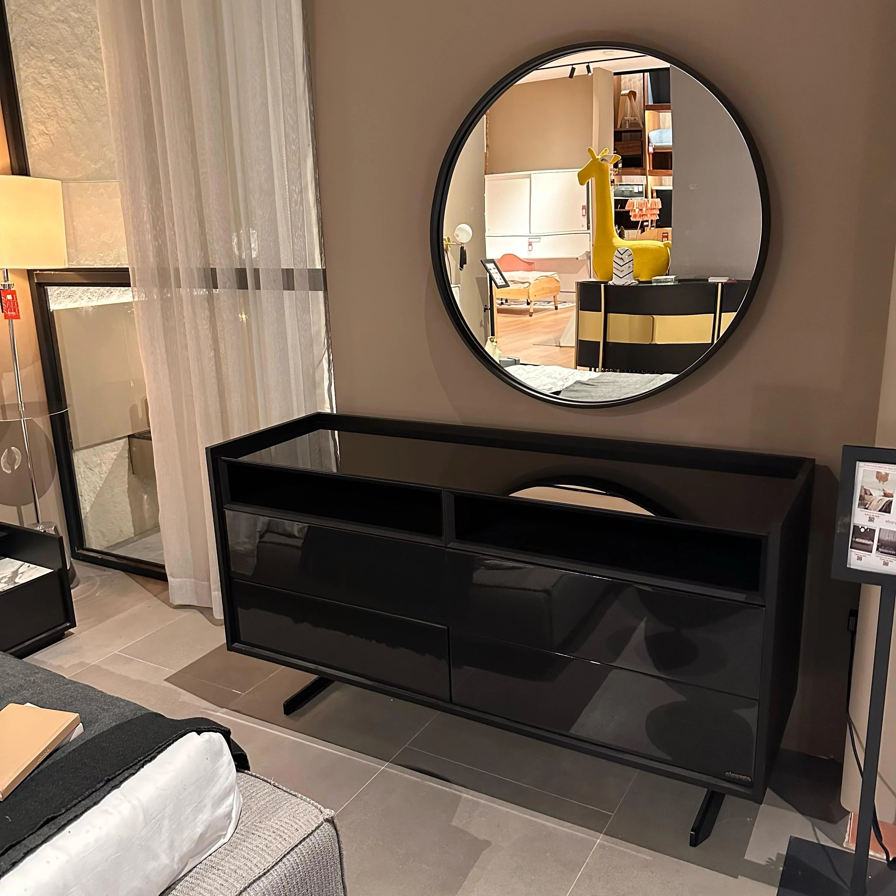 Display of a grey collection dresser and matching mirror by YOL LIVING, showcasing modern bedroom furniture.
