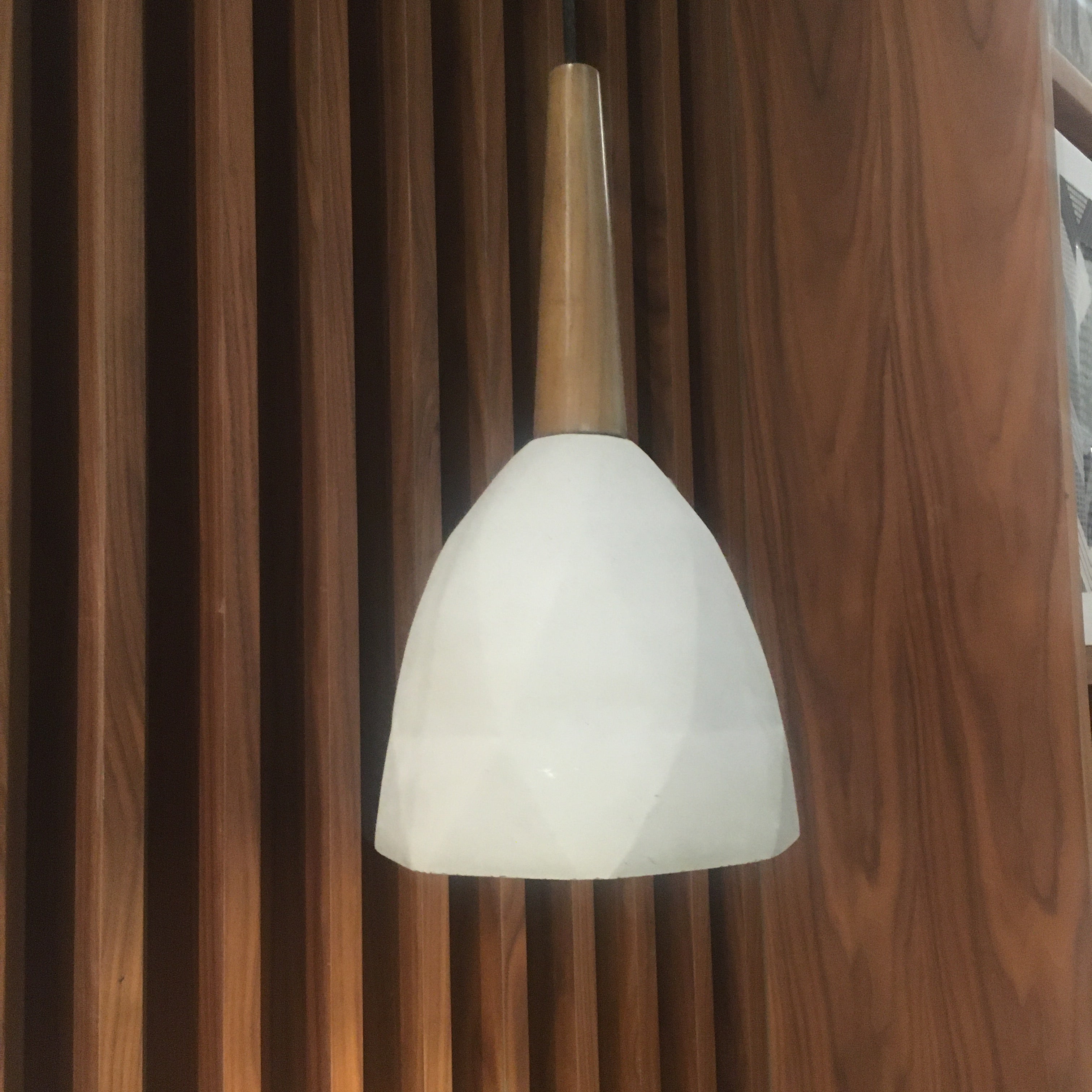 Large convex concrete and wood lamp display item by Beacon, showcasing a modern mixed-material design.