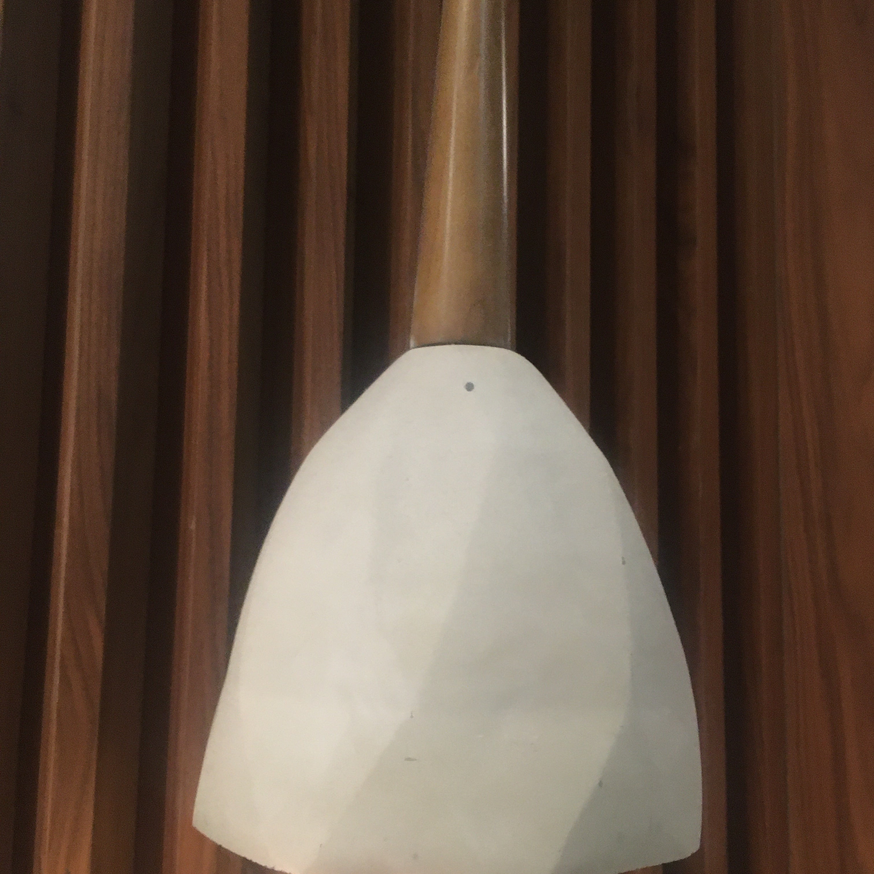 Large convex concrete and wood lamp display item by Beacon, featuring a modern design with mixed materials and sleek craftsmanship.