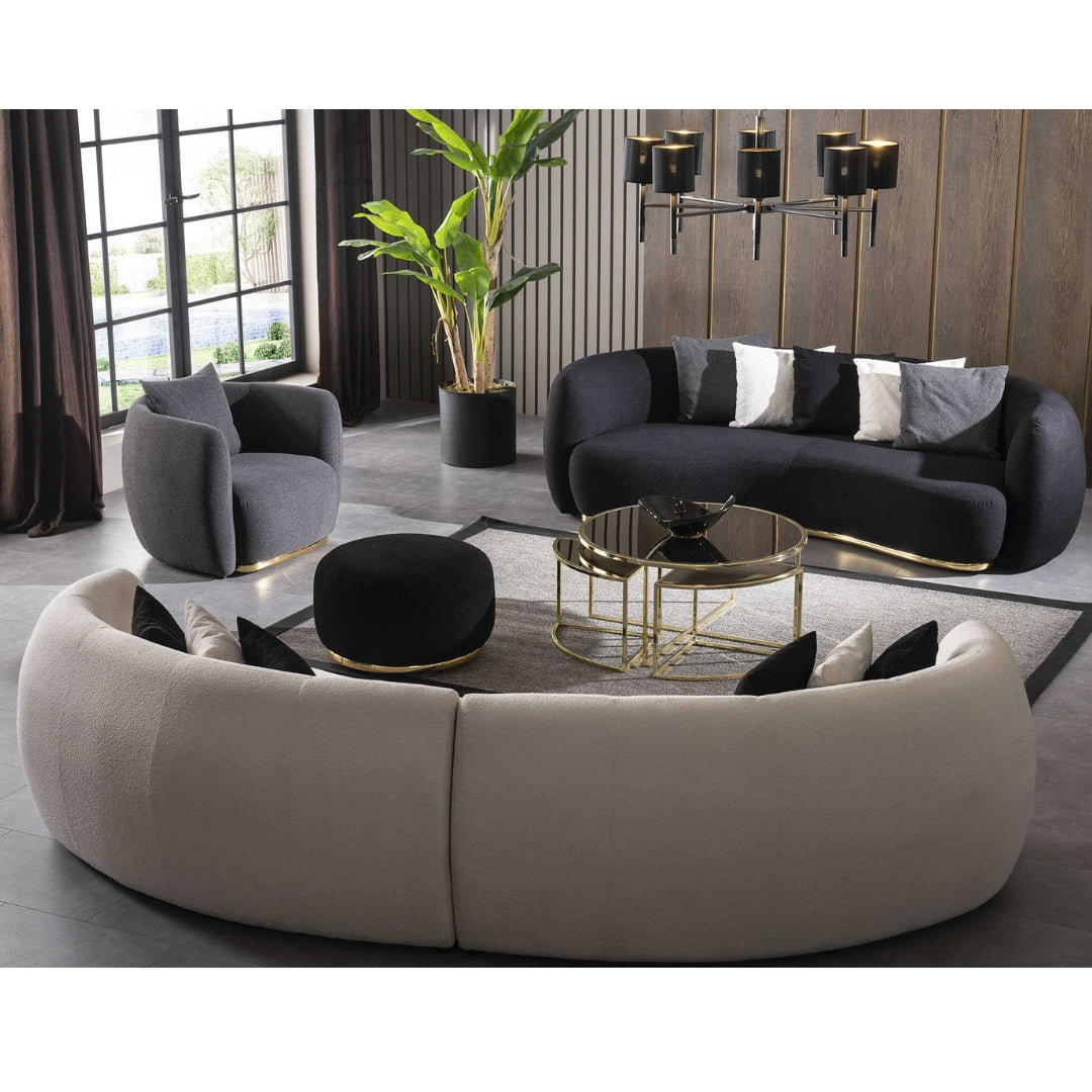 Display of a curved 4-seater sofa by Sabrino, showcasing plush brown upholstery and modern design.