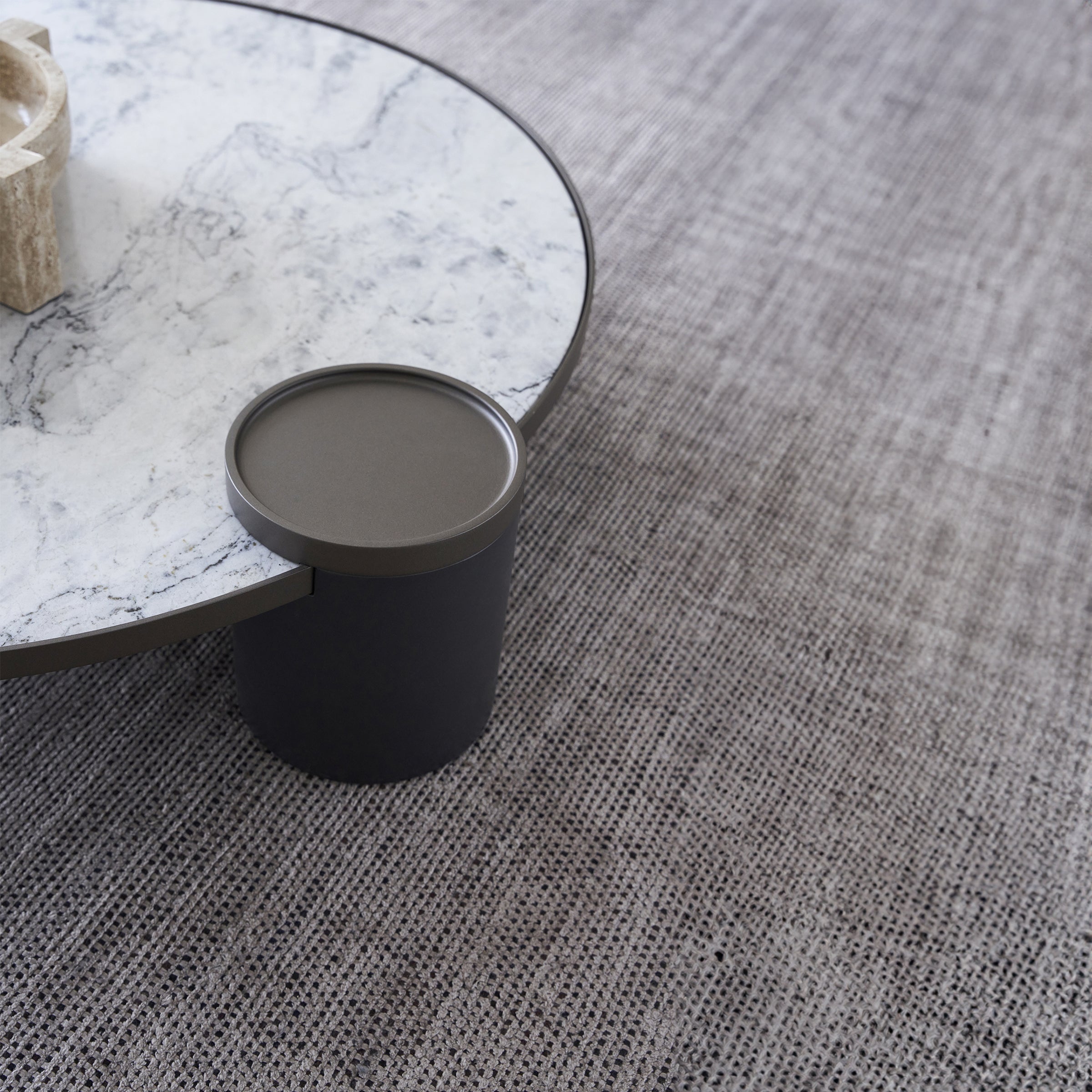 Display of a desert marble coffee table by Beacon, featuring a sleek, modern design and smooth marble surface.