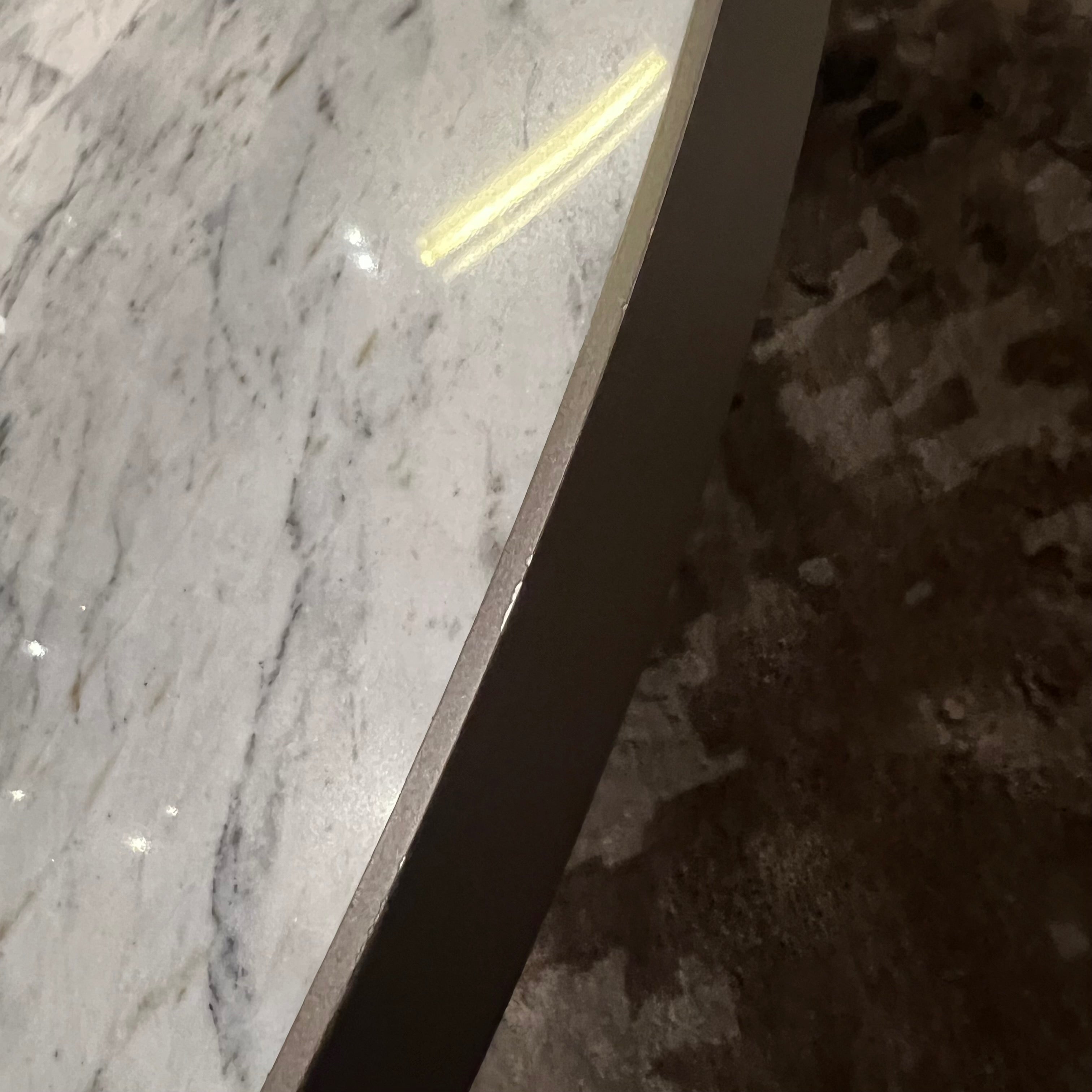 Desert marble coffee table by Beacon, modern display piece with sleek design, featuring a smooth marble surface and contemporary style.